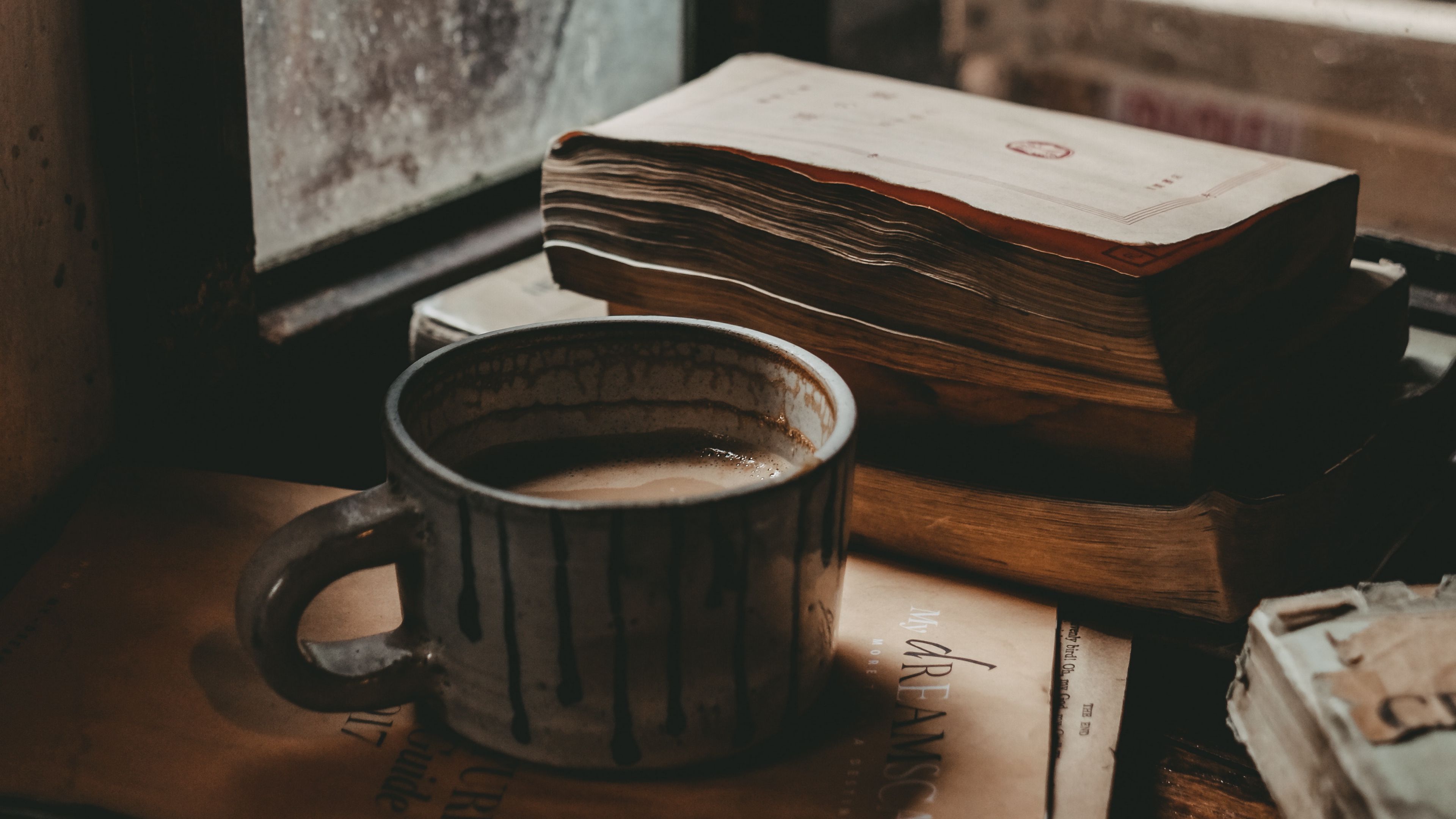 Download wallpaper 3840x2160 mug, books, mood, window, autumn 4k uhd 16:9 HD background