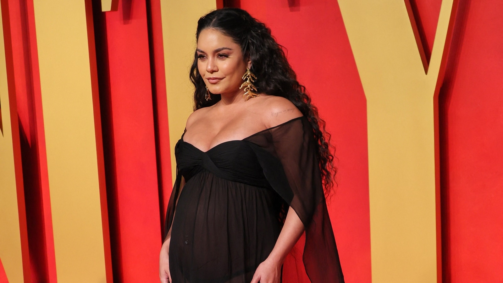 Vanessa Hudgens shows baby bump in see
