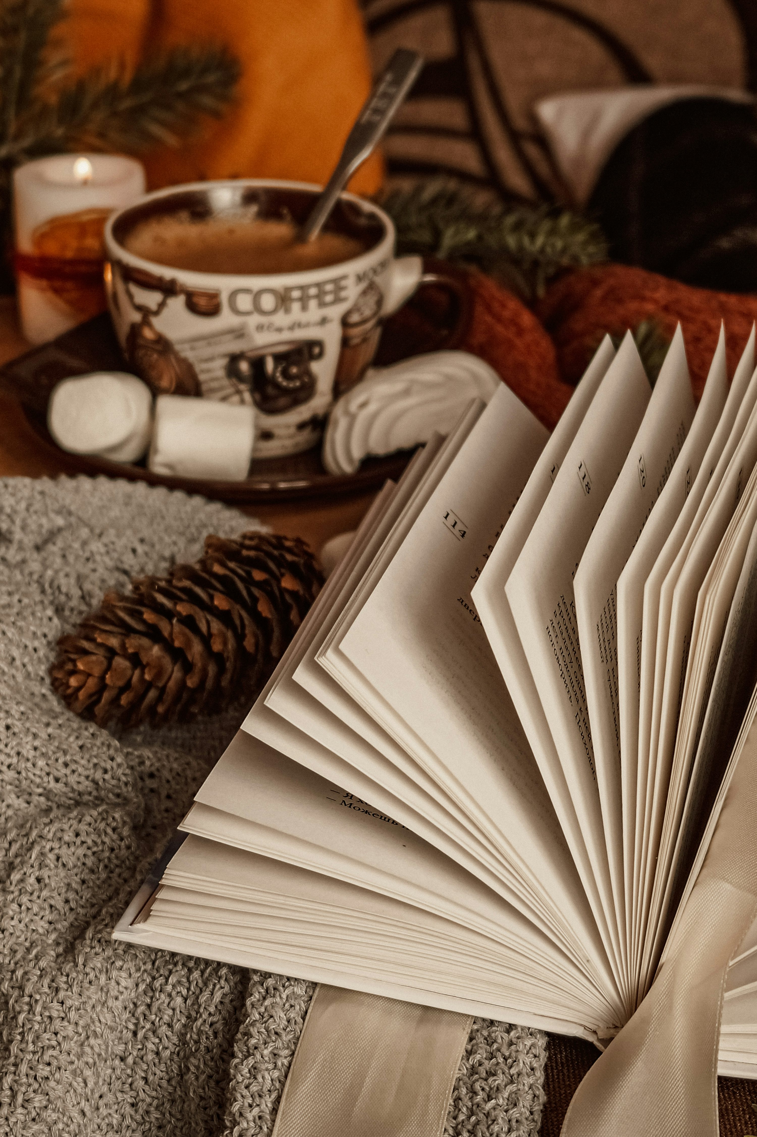 brown and white ceramic mug