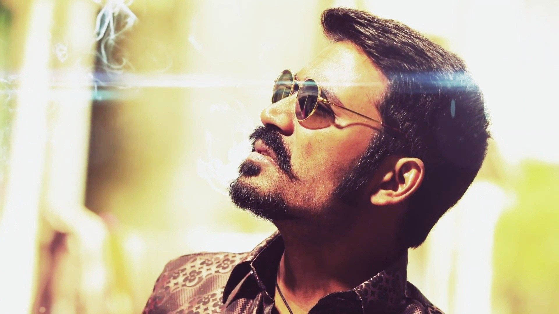 Download Action Star Dhanush Blowing