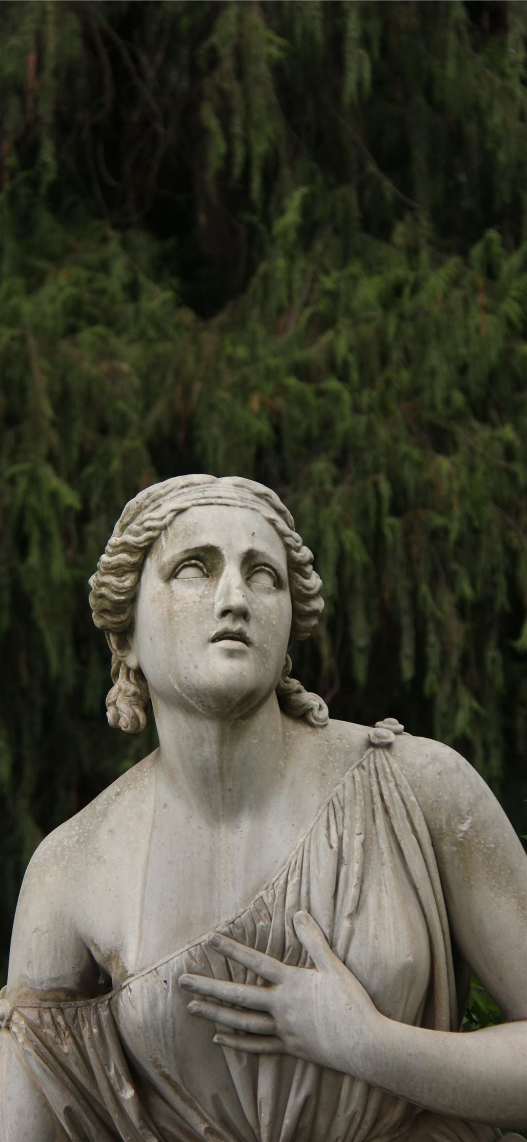 woman statue during daytime iPhone