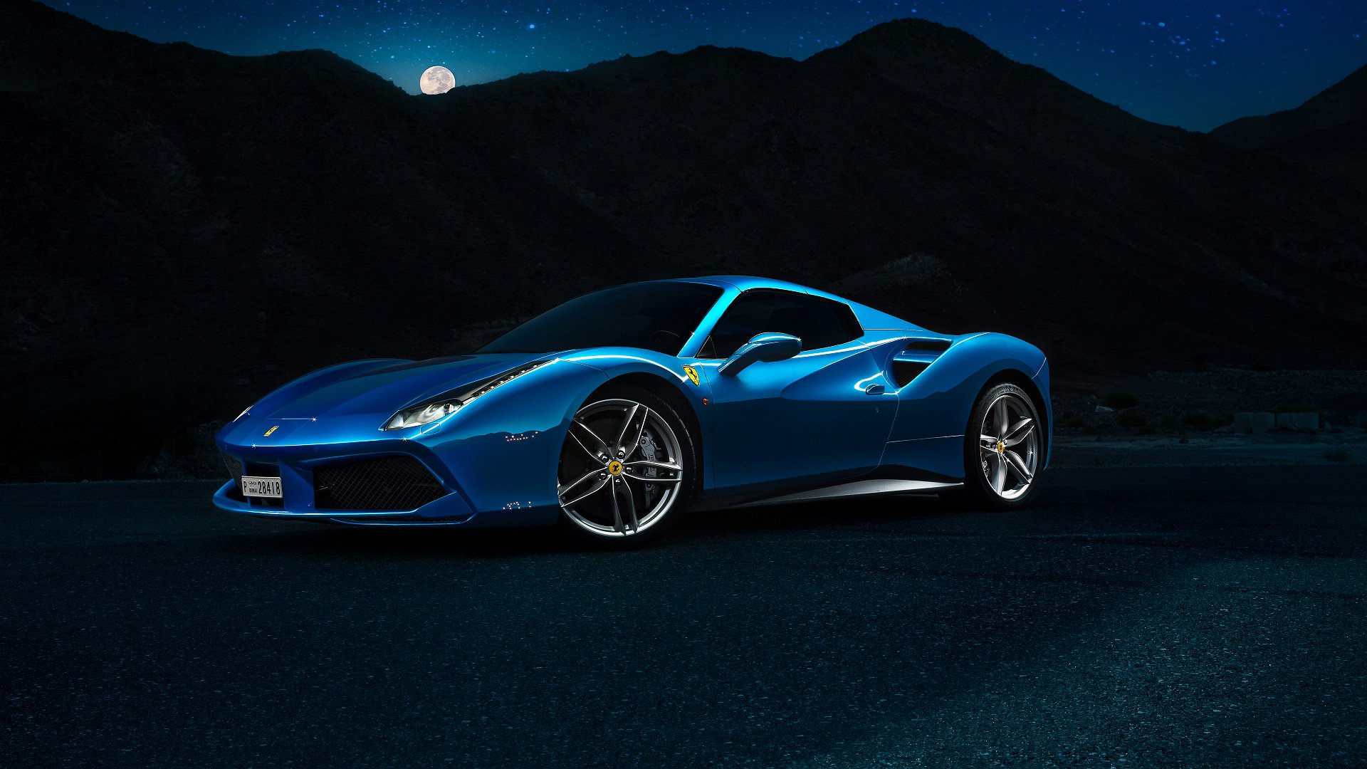 Night moon and blue Ferrari car
