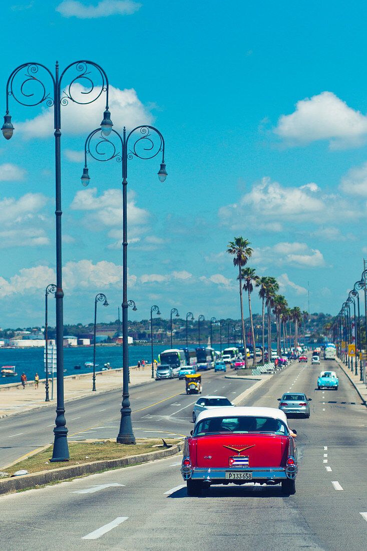 Classic red car on the coast road
