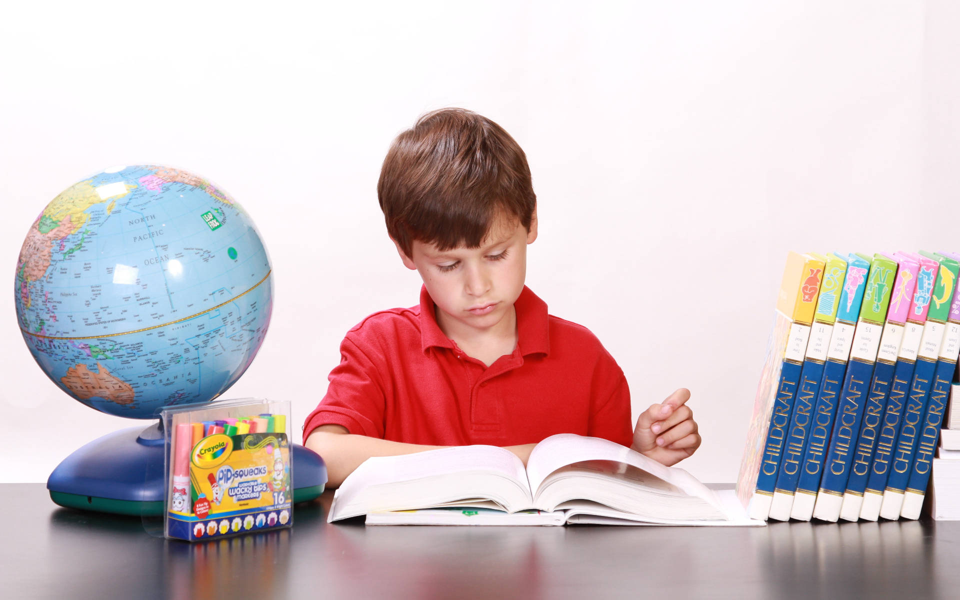 Download Young Boy Reading Educational