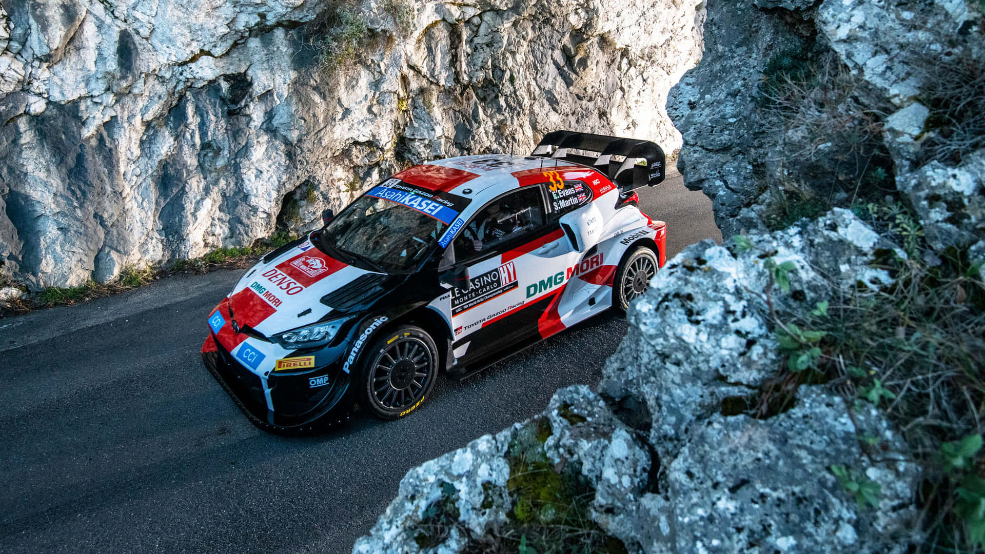Download W R C Rally Car Speeding Through Mountain Wallpaper