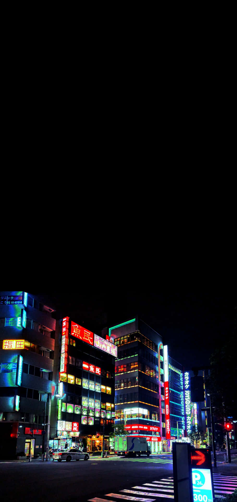 Download A Street With Buildings And A Street Light Wallpaper