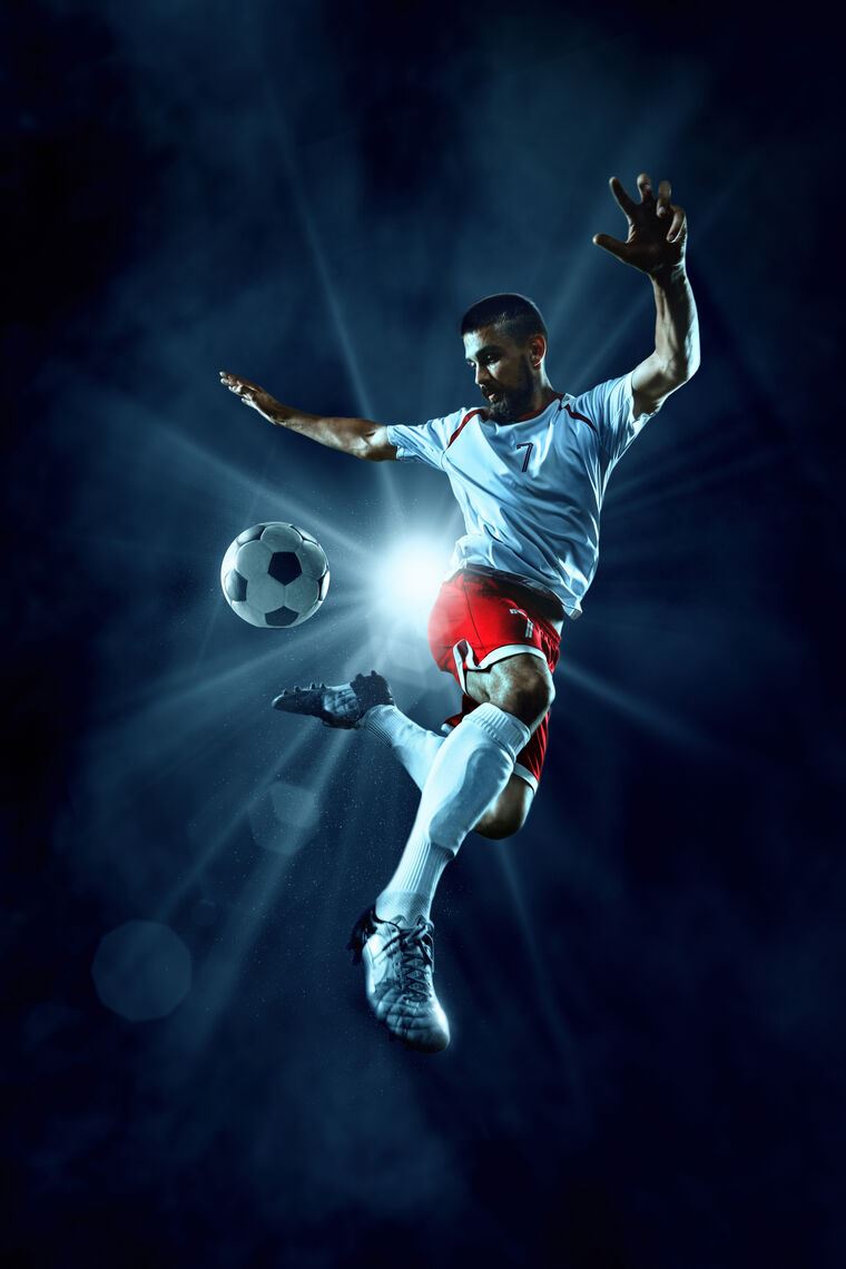 wallpaper Soccer player jump kick ball