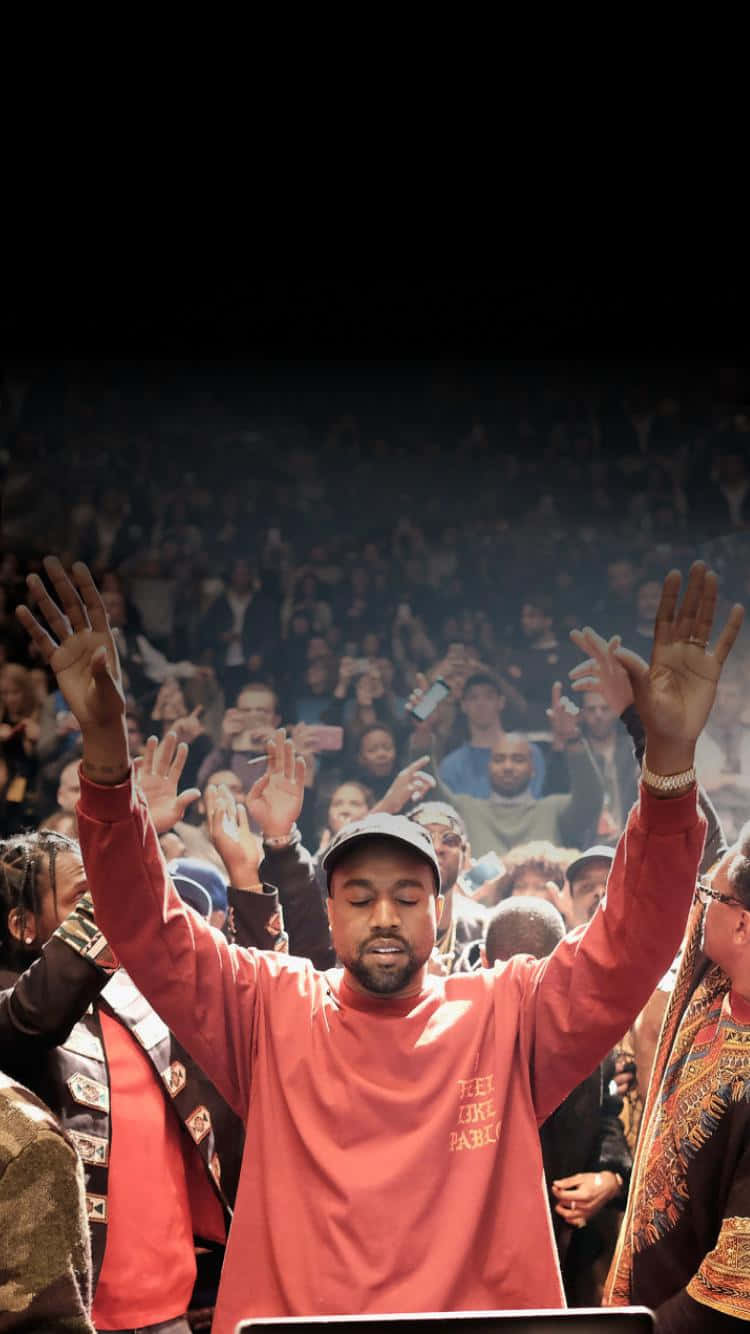 Kanye West At A Concert With His Hands