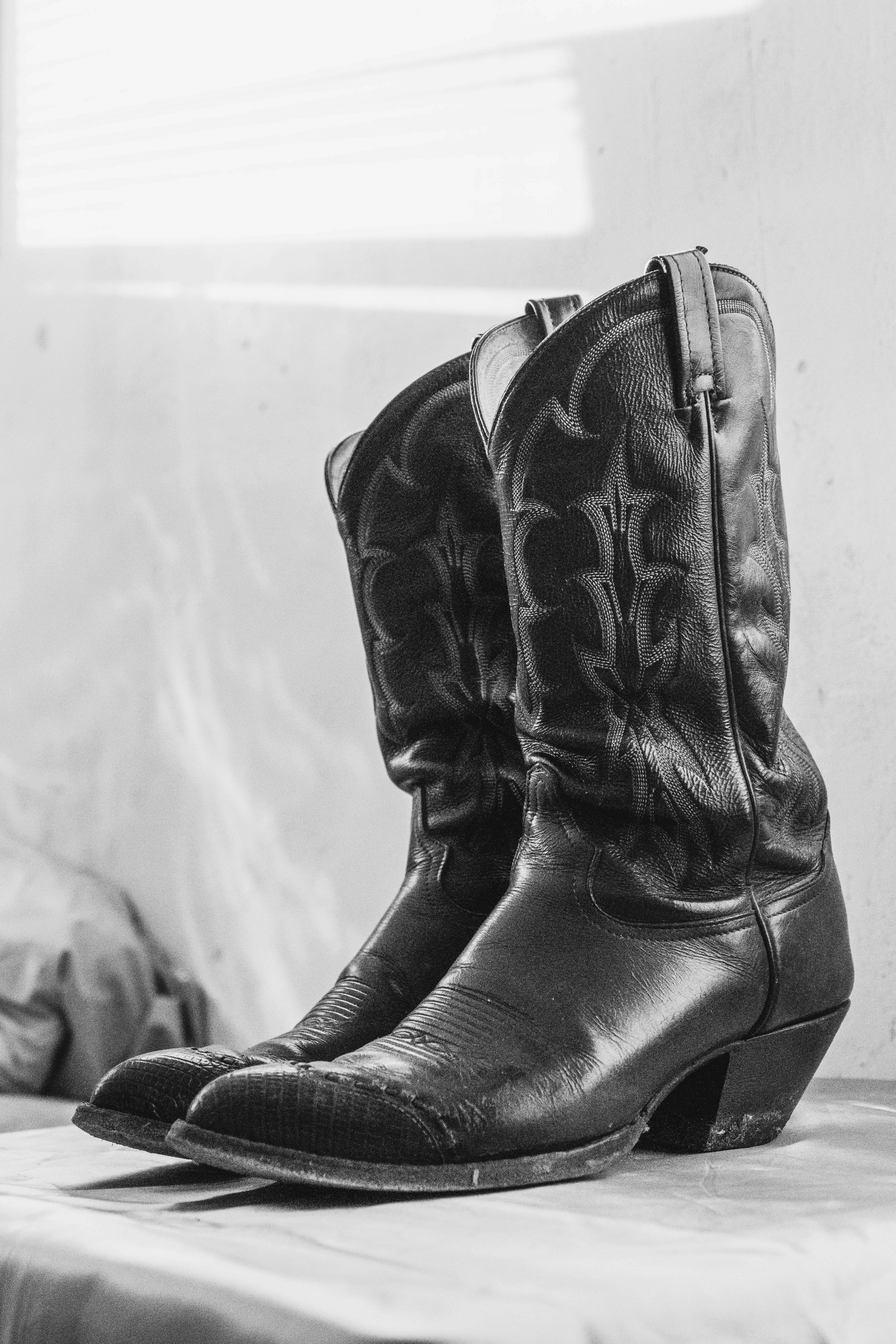 Grayscale Photo of Leather Boots · Free