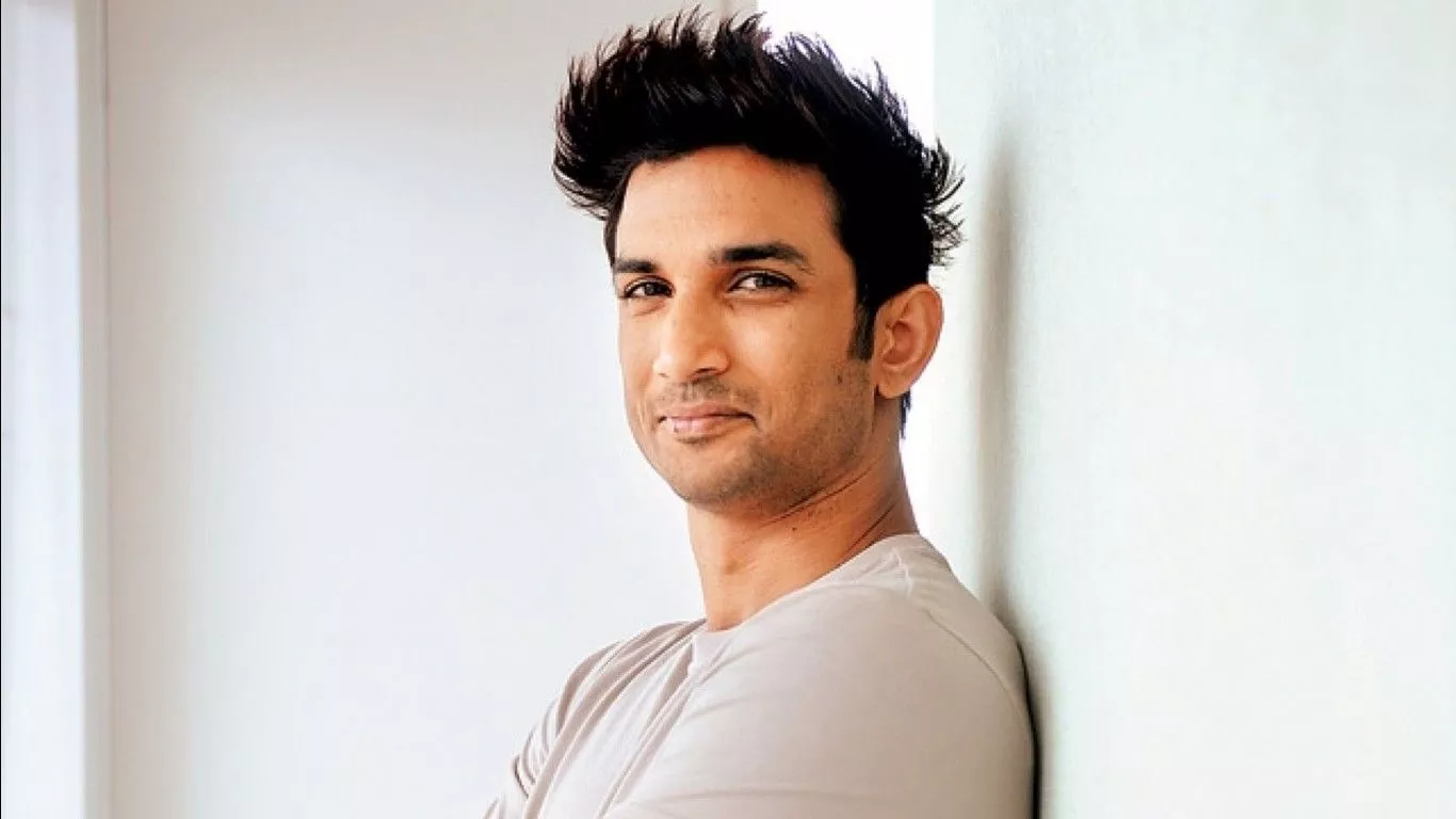 Sushant Is Leaning Back On White Wall