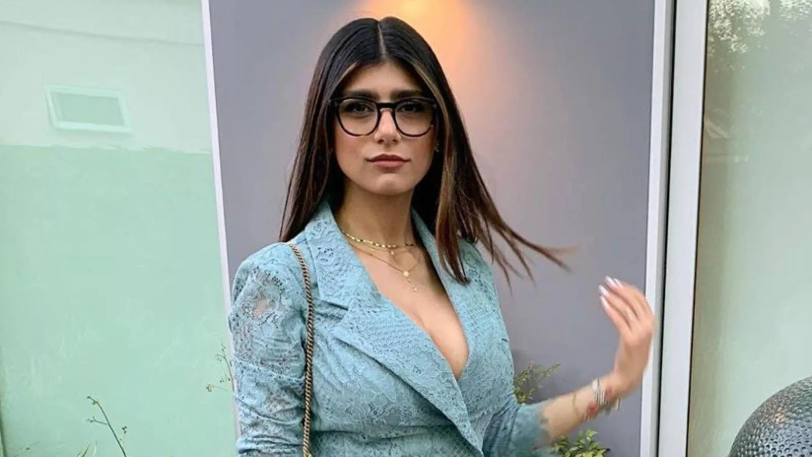 Download Mia Khalifa Wearing A Suit Wallpaper