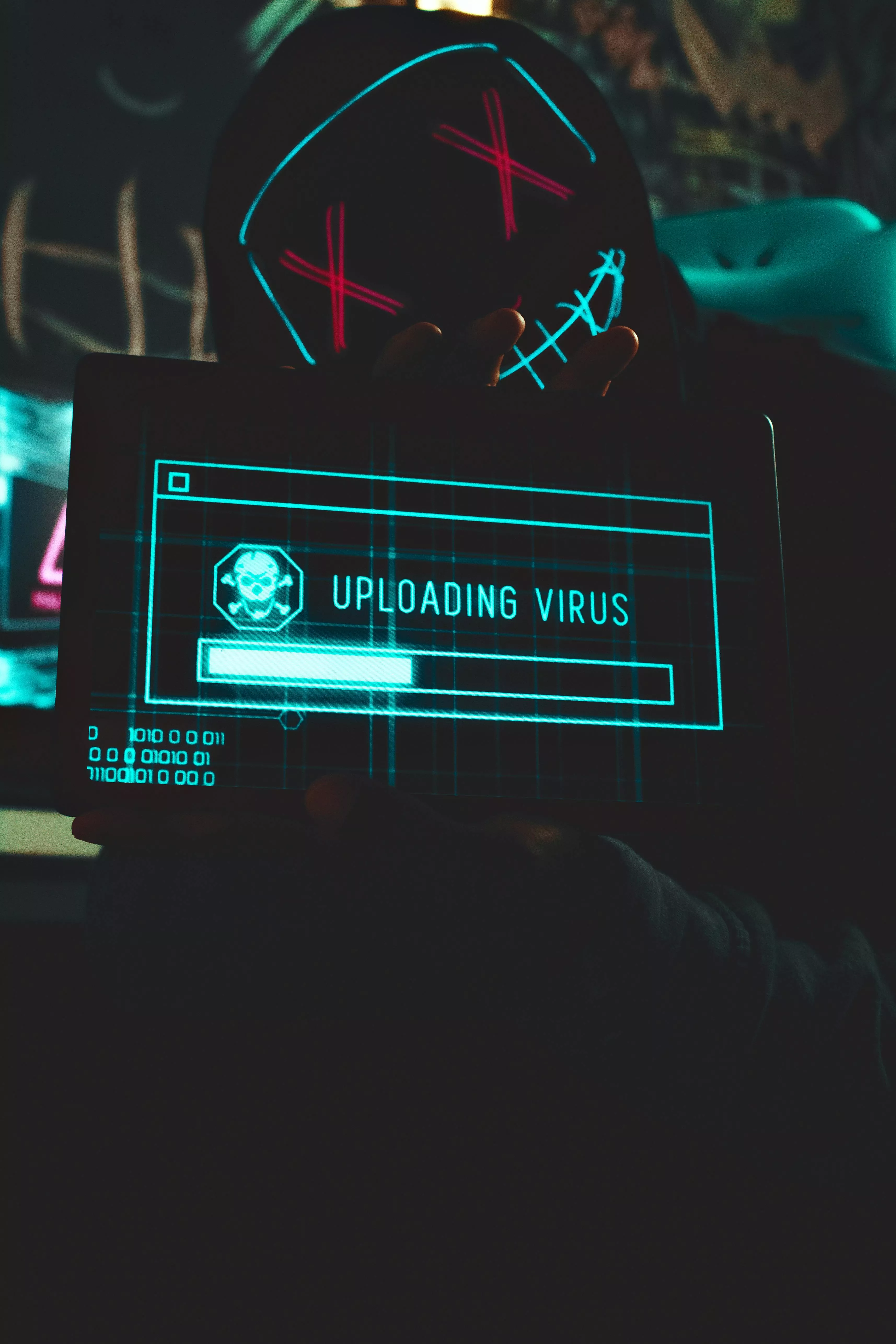 Hacker Holding Screen with Virus · Free
