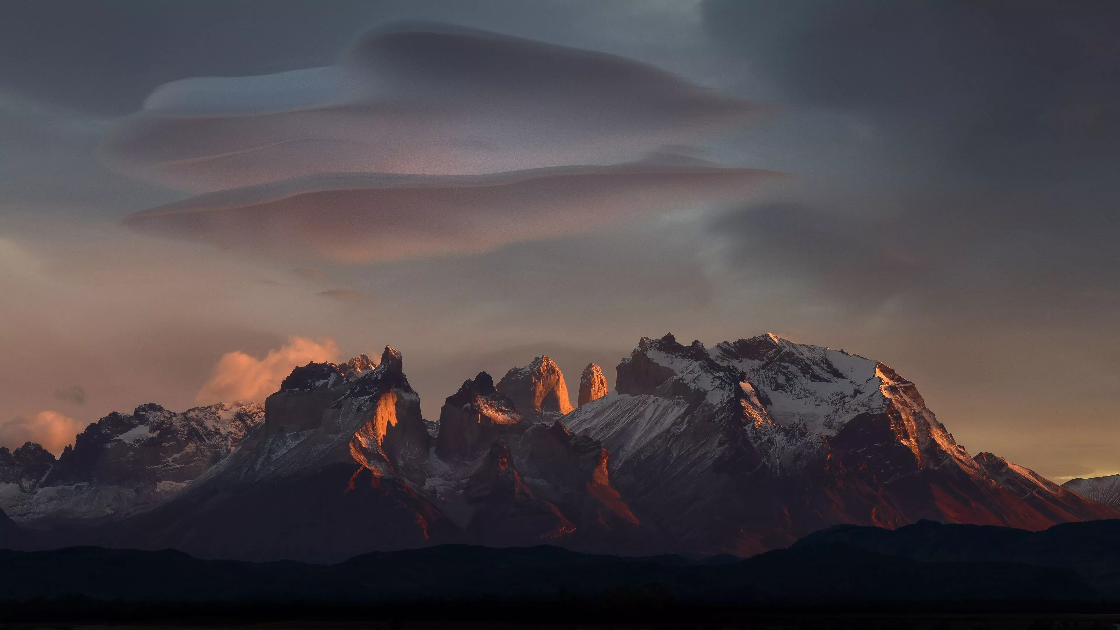 snow covered mountains peaks clouds