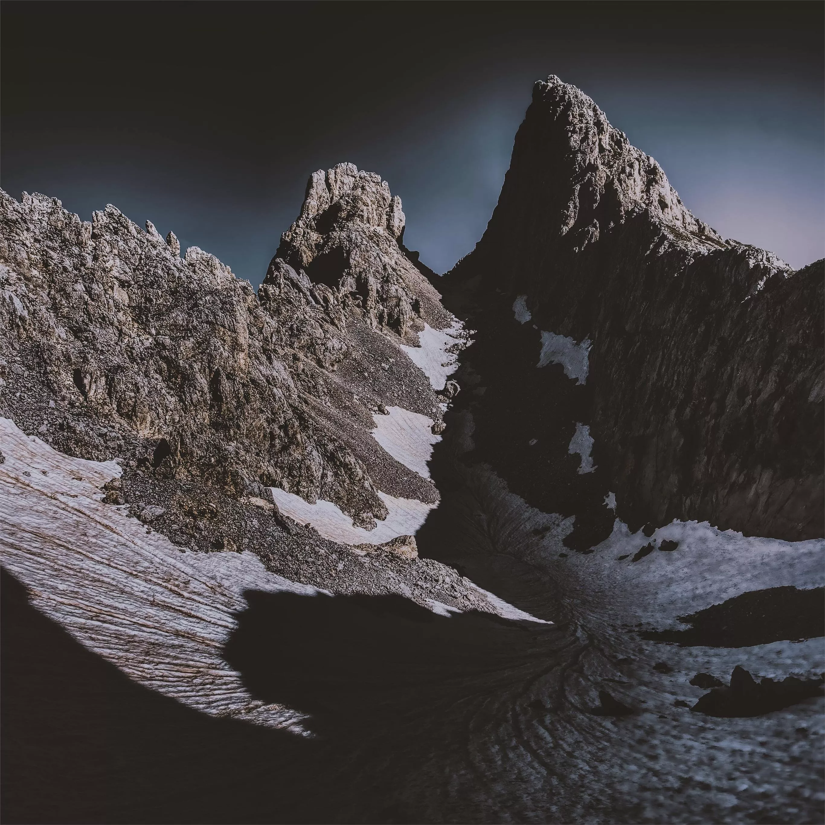 dark mountains covered by snow 5k iPad