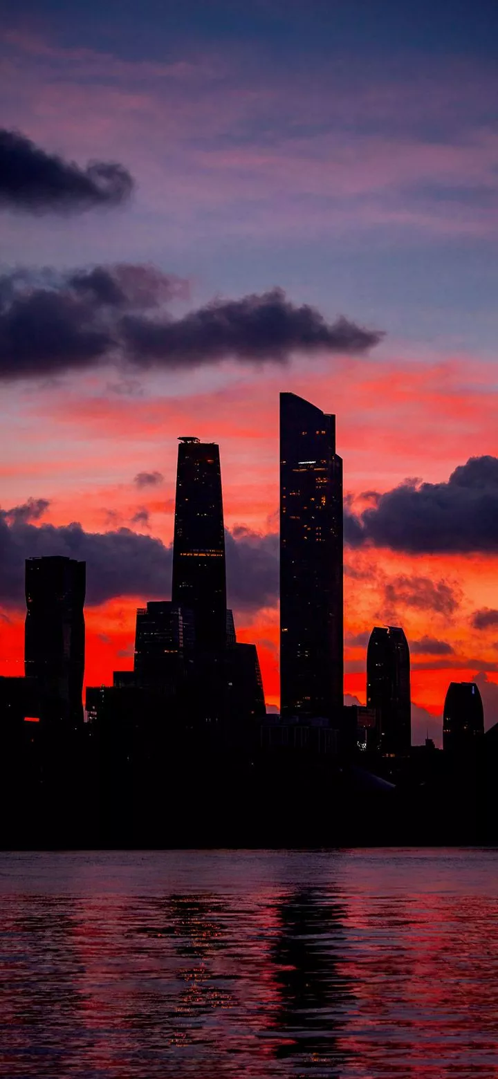 Dark city towers at sunset 4K Phone
