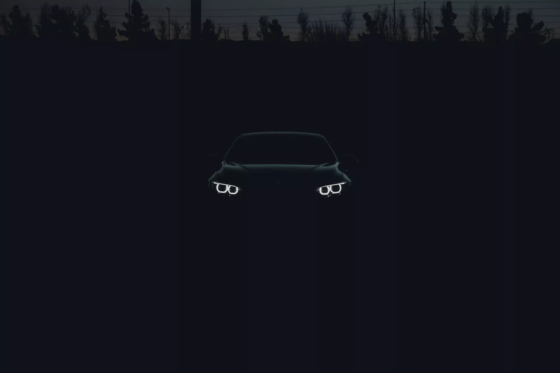 Black Bmw Car In The Shadows Wallpaper