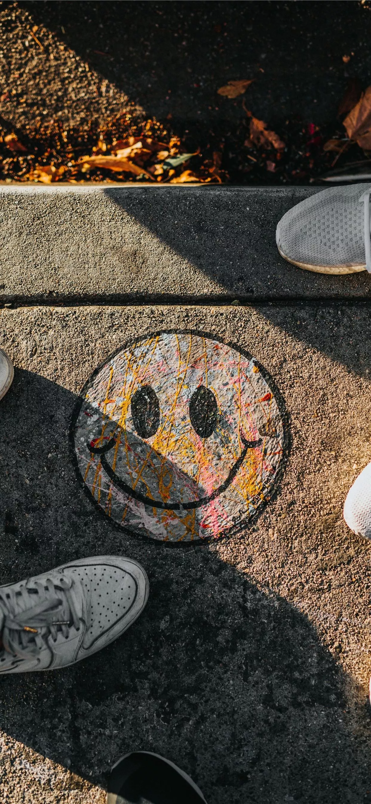 smiley paint on gray ground in front