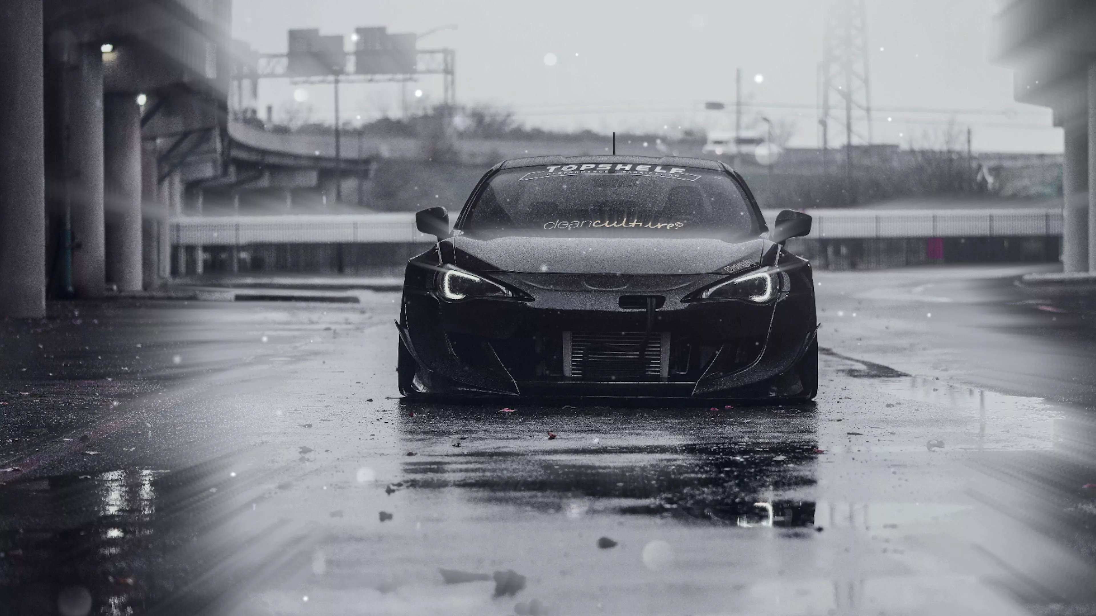 Black Sports Car in the Wet Streets