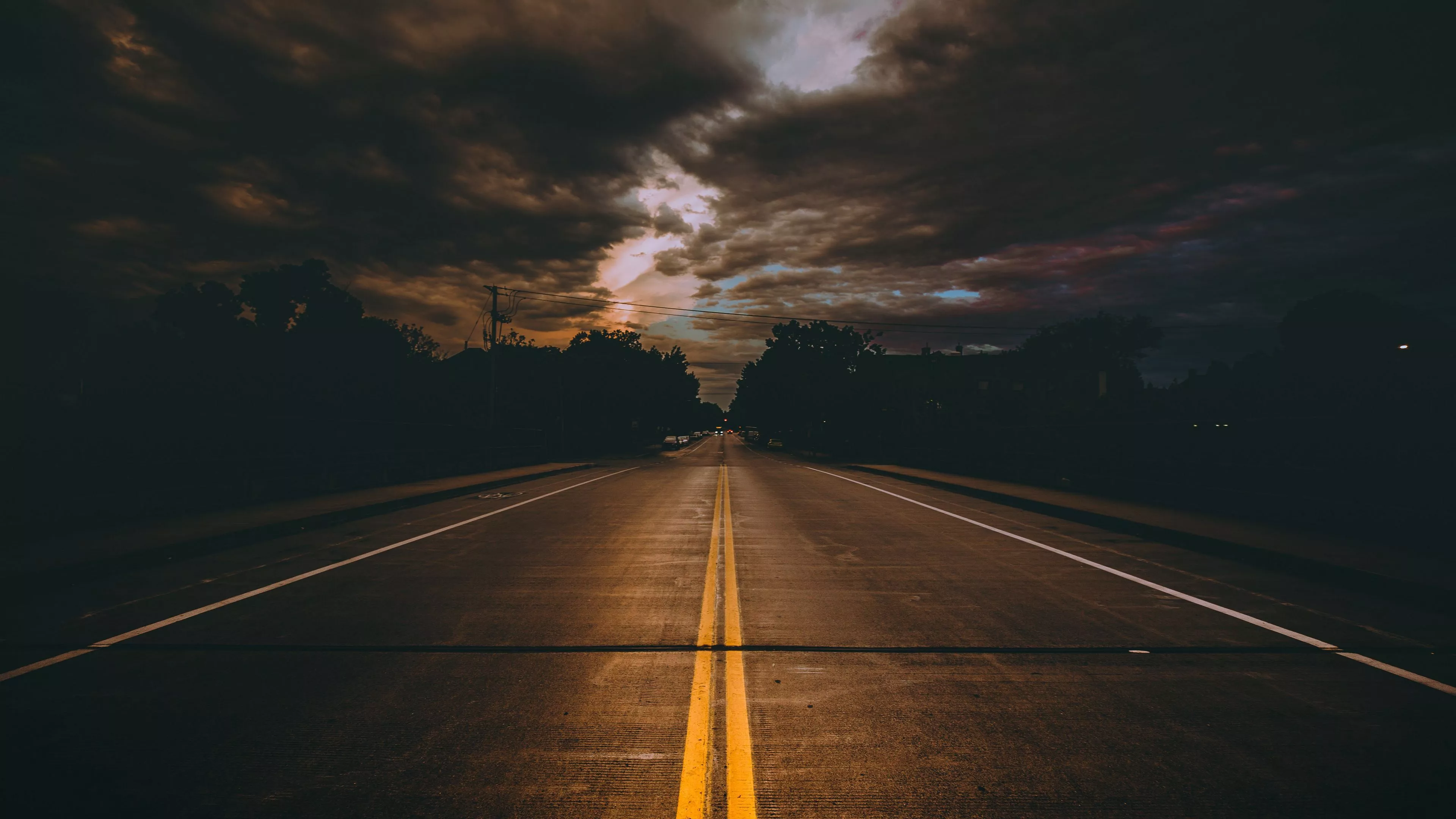 Road Trees Under Black Clouds Blue Sky