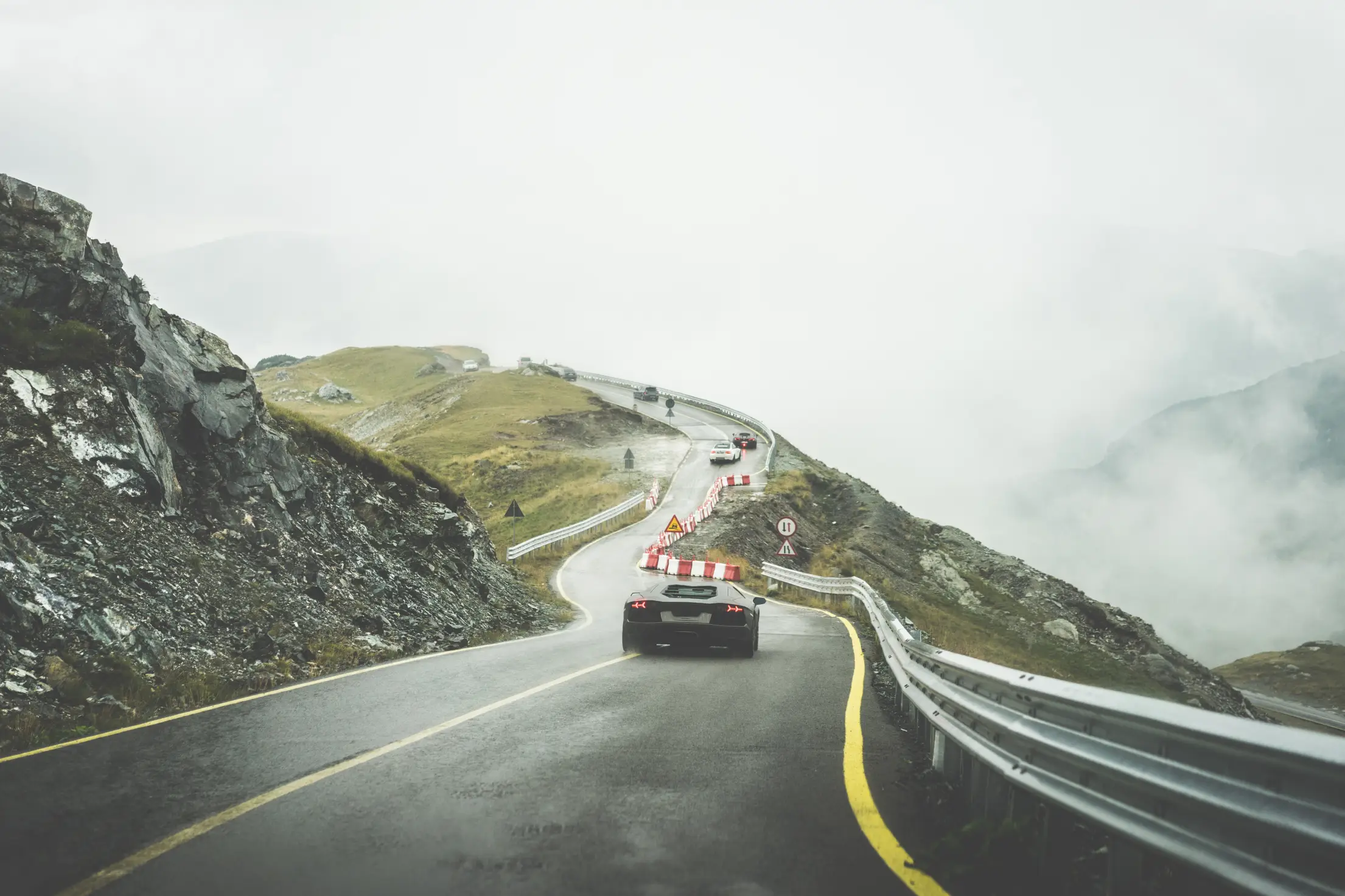 Sport Cars on Wet Mountain Road