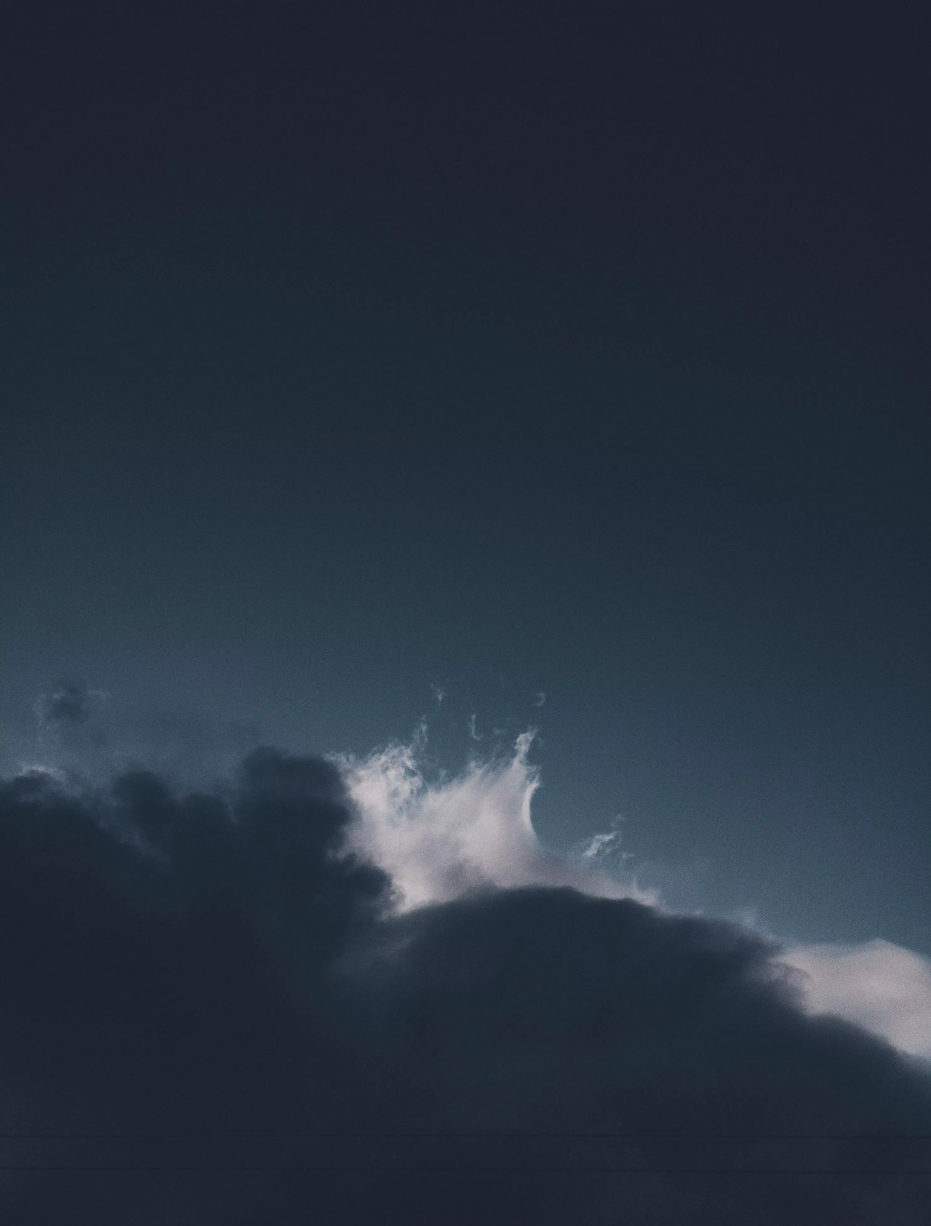 White Clouds in a Dark Sky · Free Stock