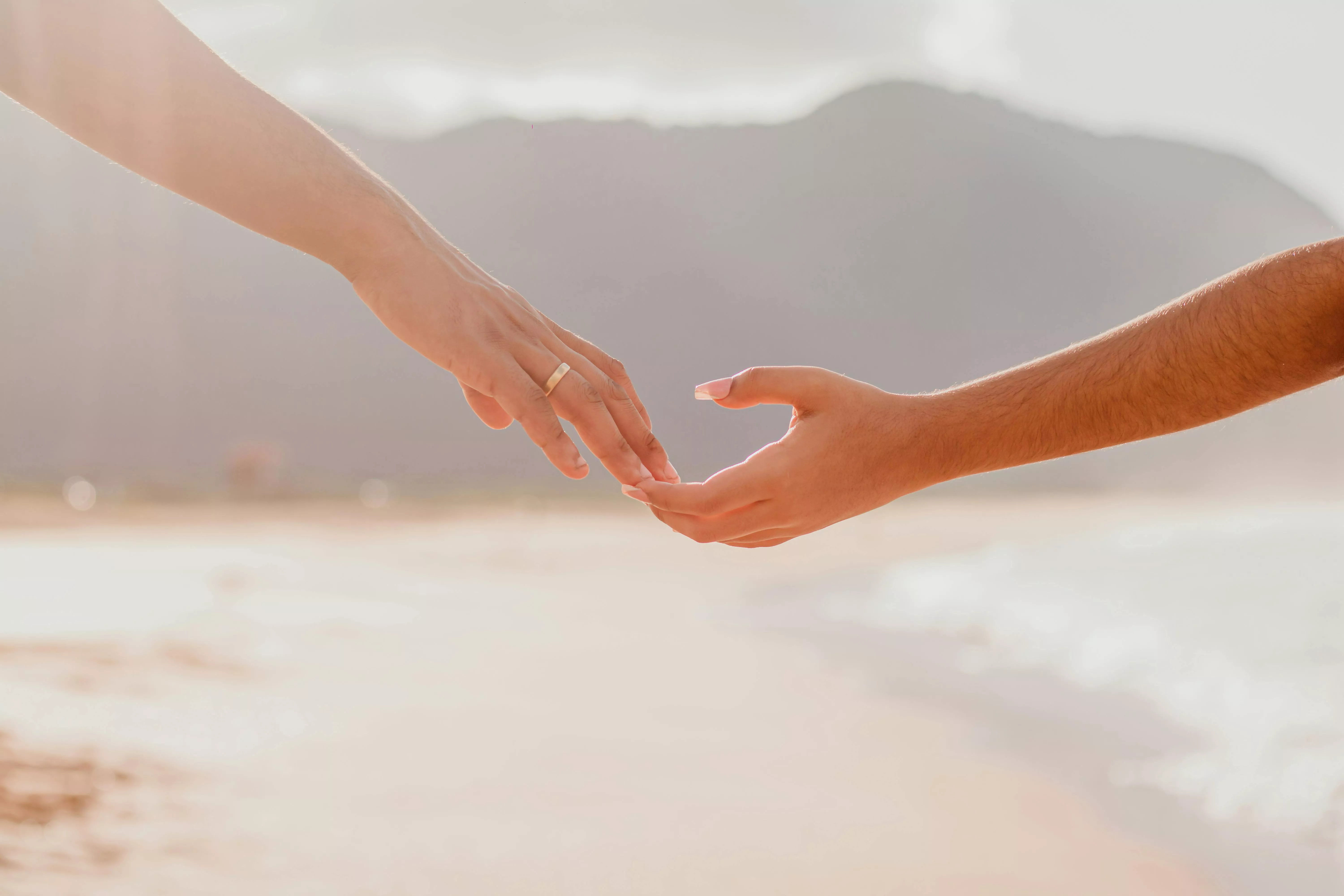 Couple Hands over Beach · Free