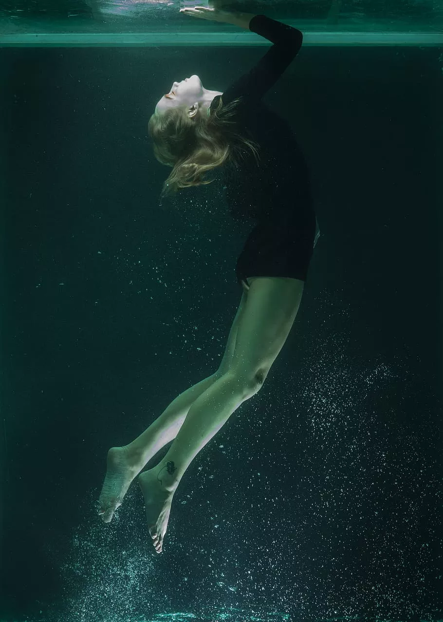 Photo of Woman Swimming Underwater