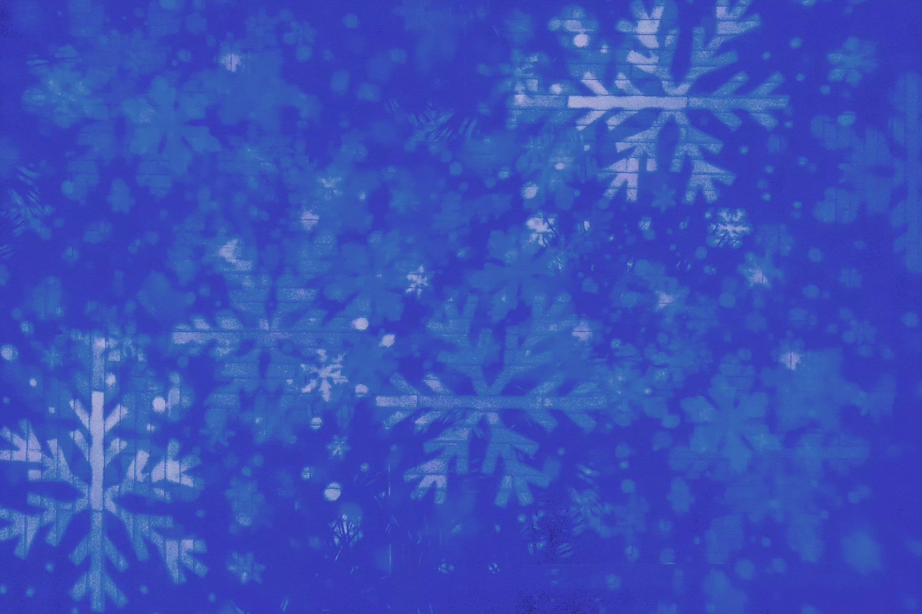 A blue background with white snowflakes