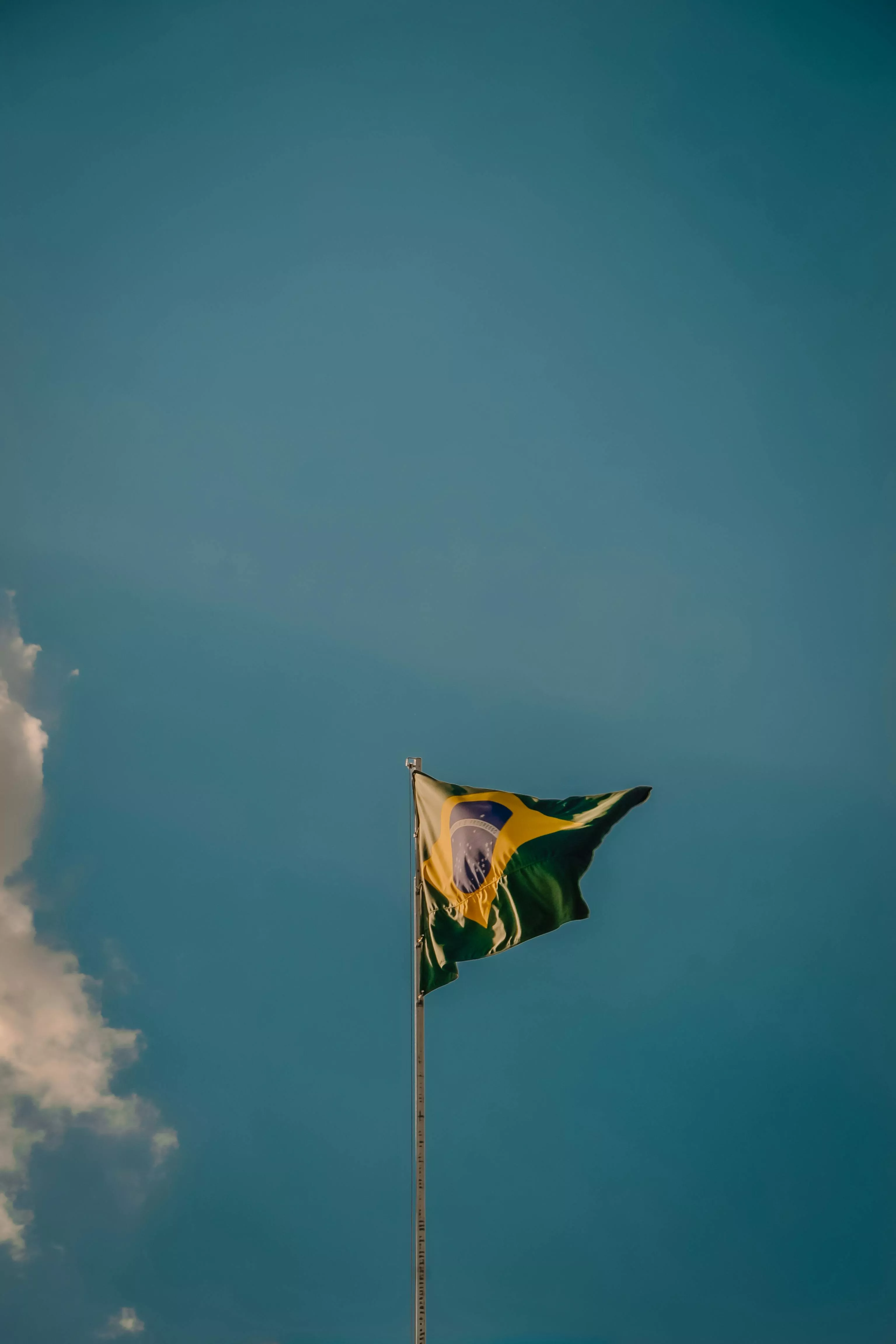 Flag of Brazil under Clear Sky · Free