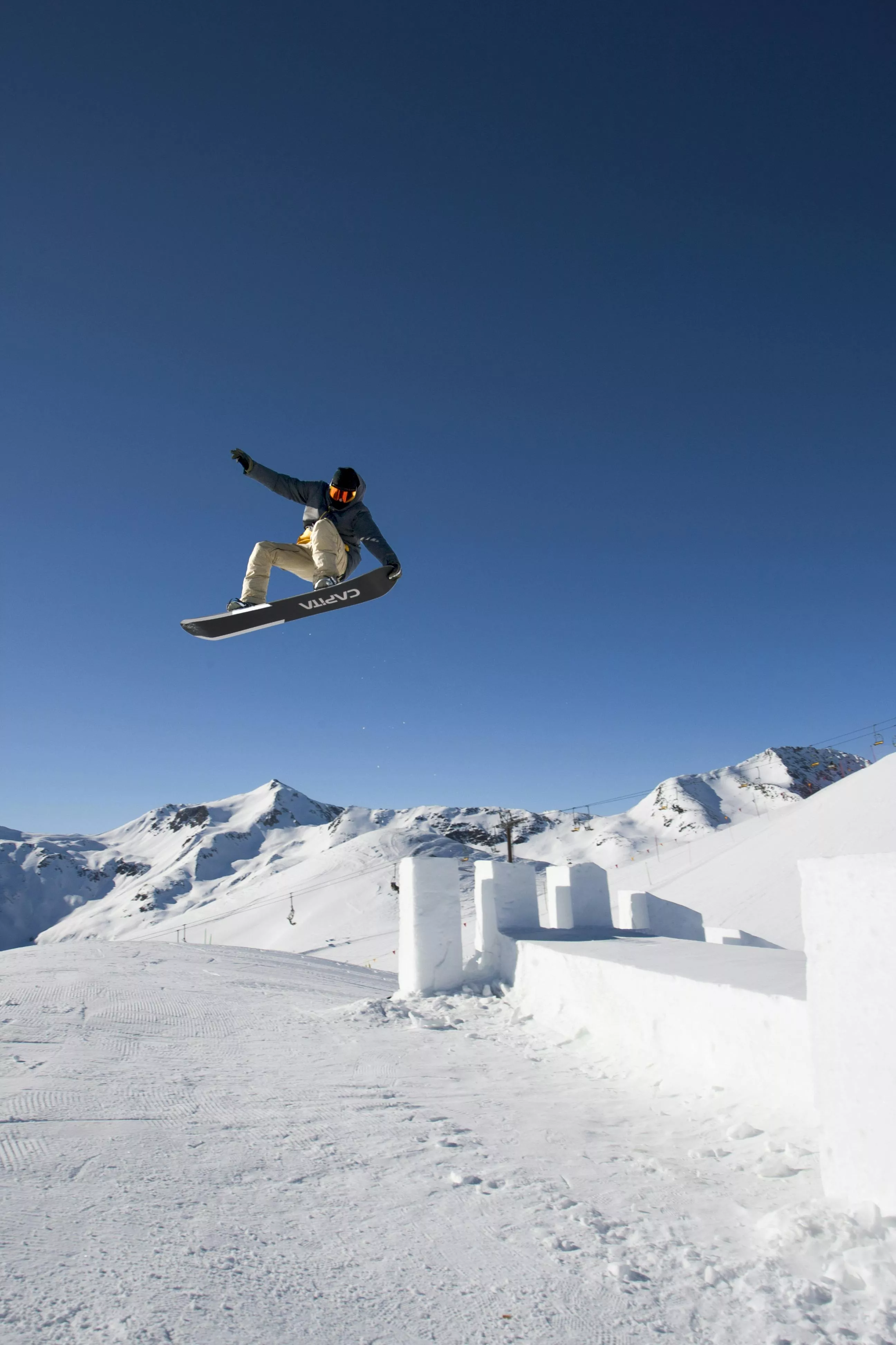 Snowboarder Jumping in Livigno Snowpark
