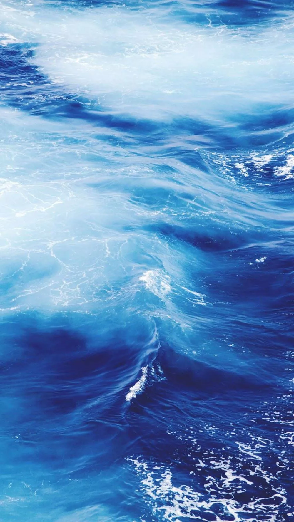 Image Bright Blue Ocean Waves Against A