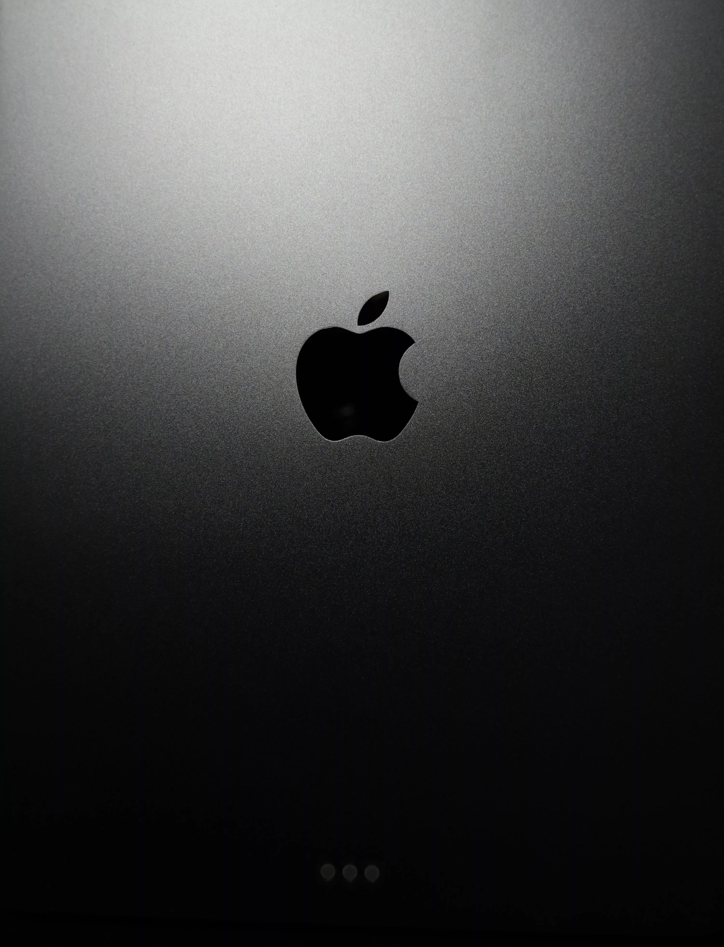 Black apple logo on black surface photo