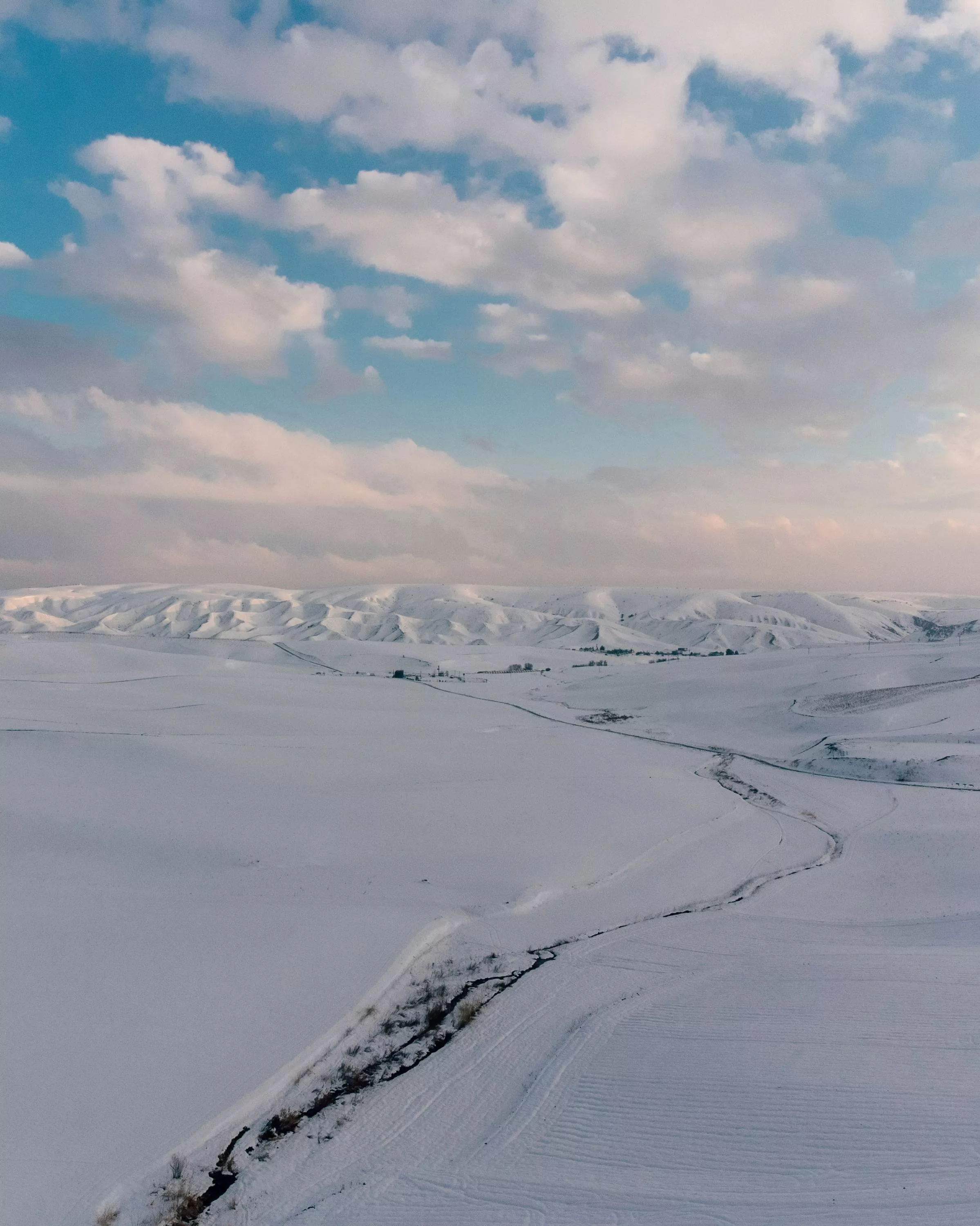Snow Covered Mountain Under Cloudy Sky