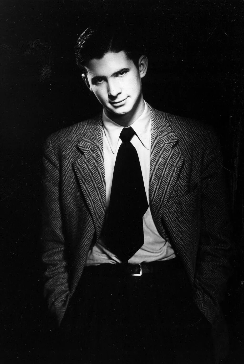 Young Anthony Perkins wearing a tweed