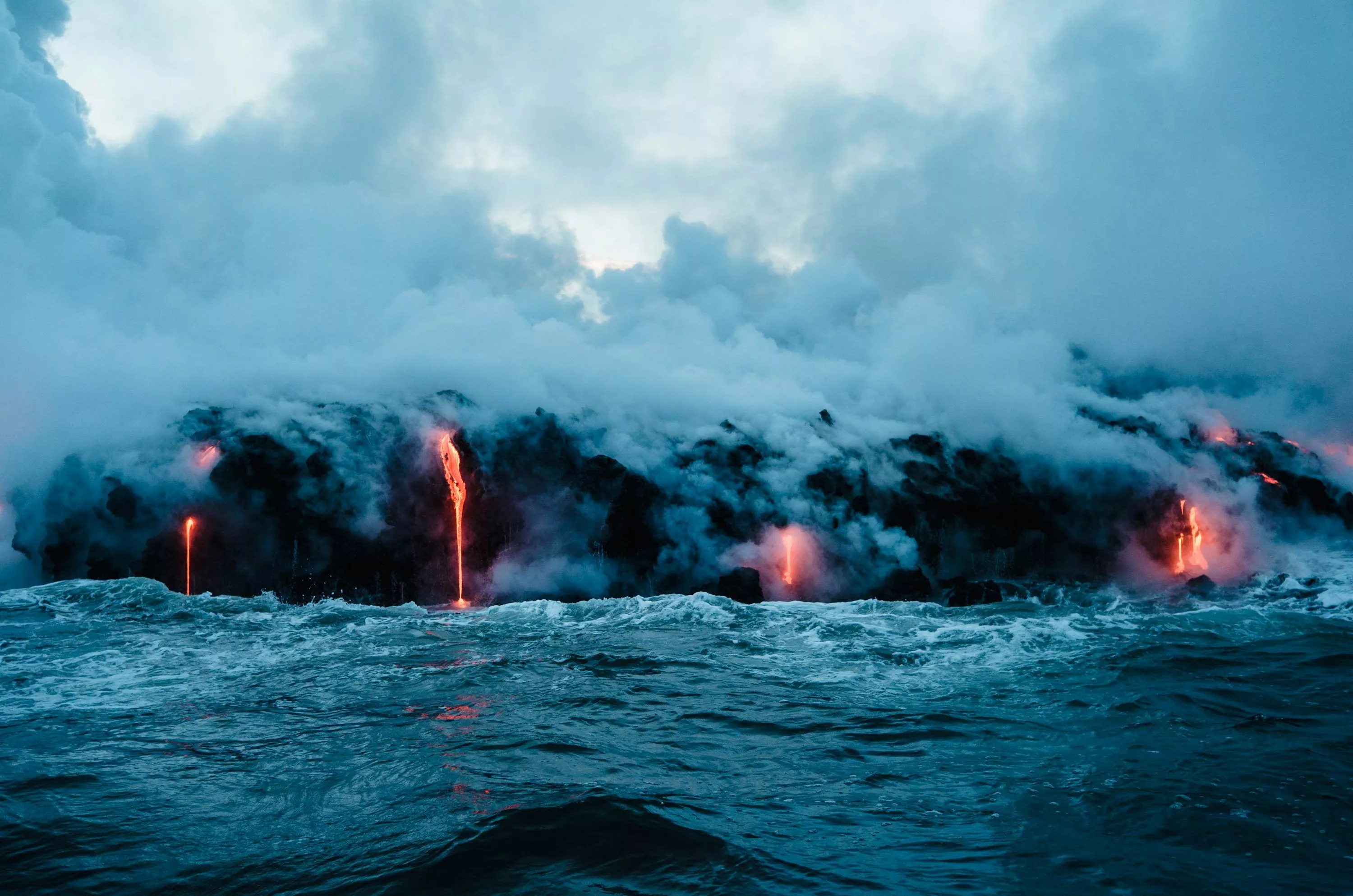 Lava dripping to ocean photo