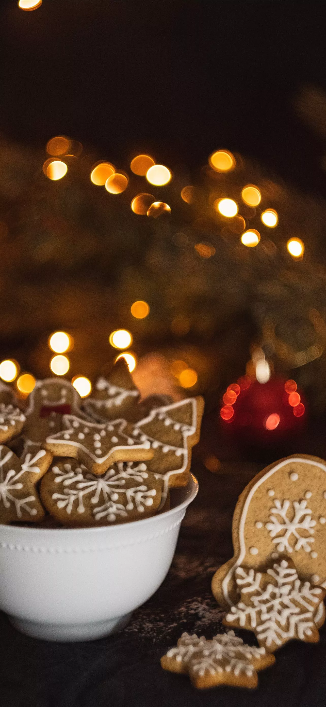 cookies in bowl near Christmas tree