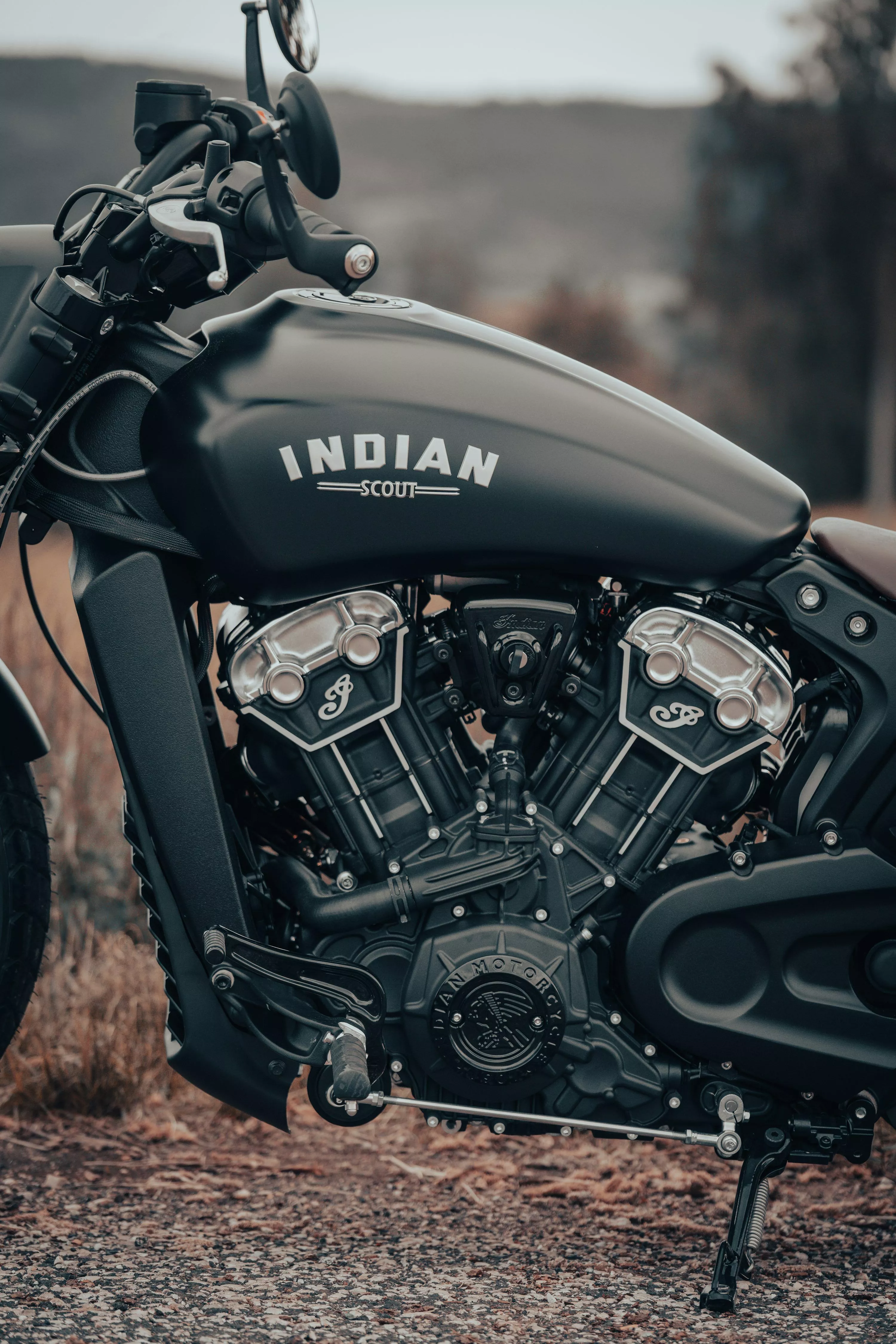 A black indian scout motorcycle parked