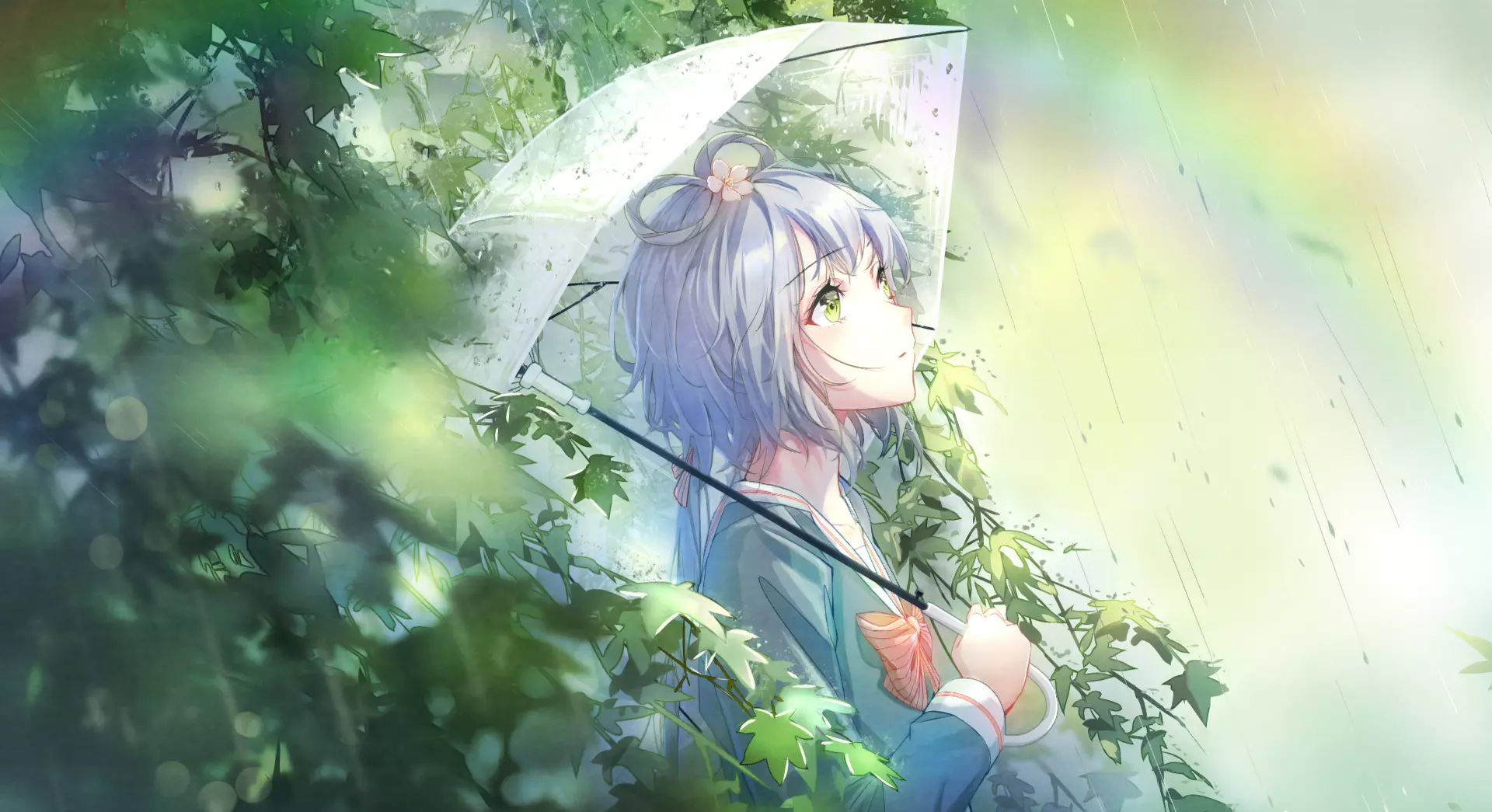 an umbrella stands by a tree bush