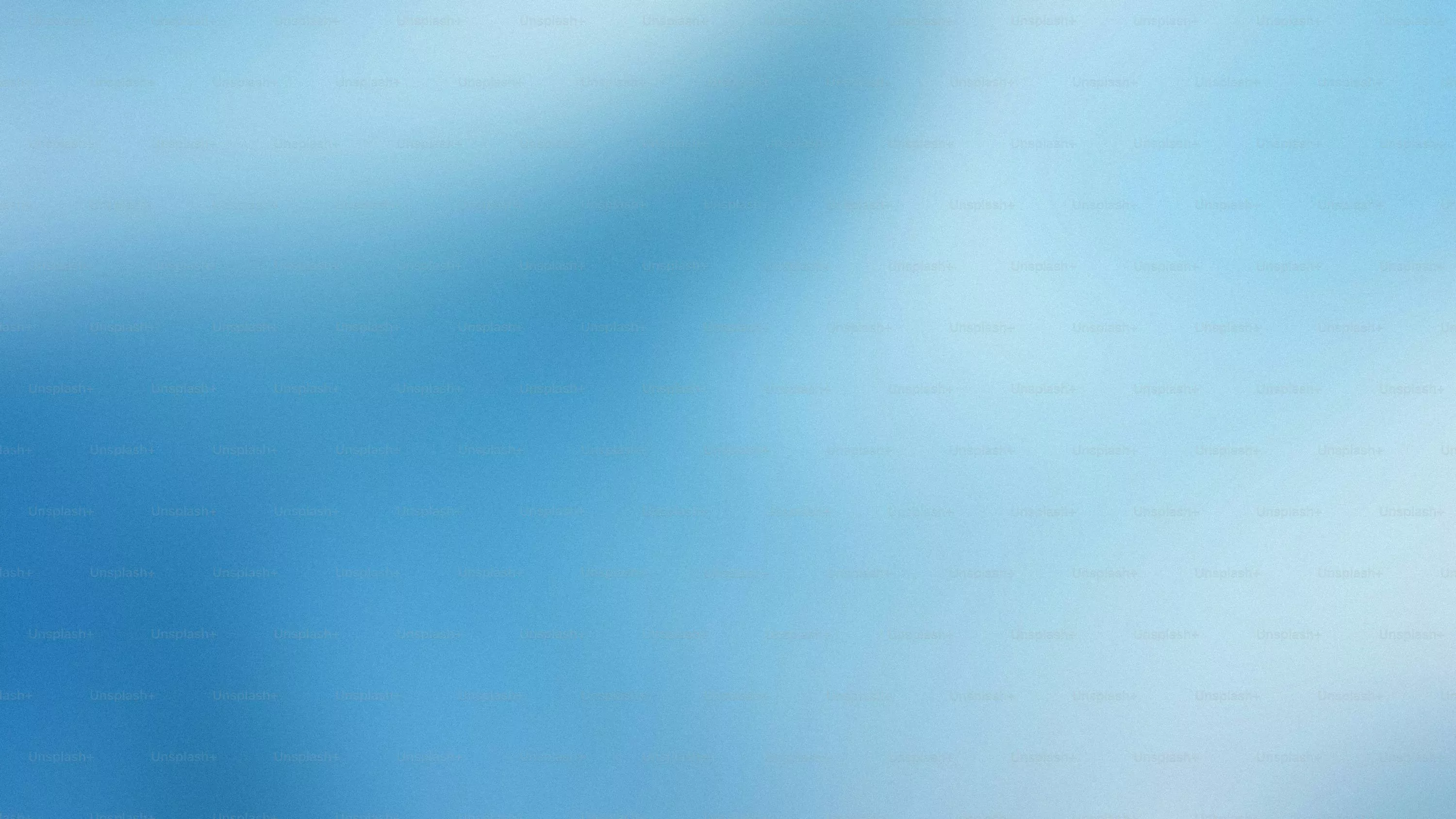 A blurry image of a blue and white