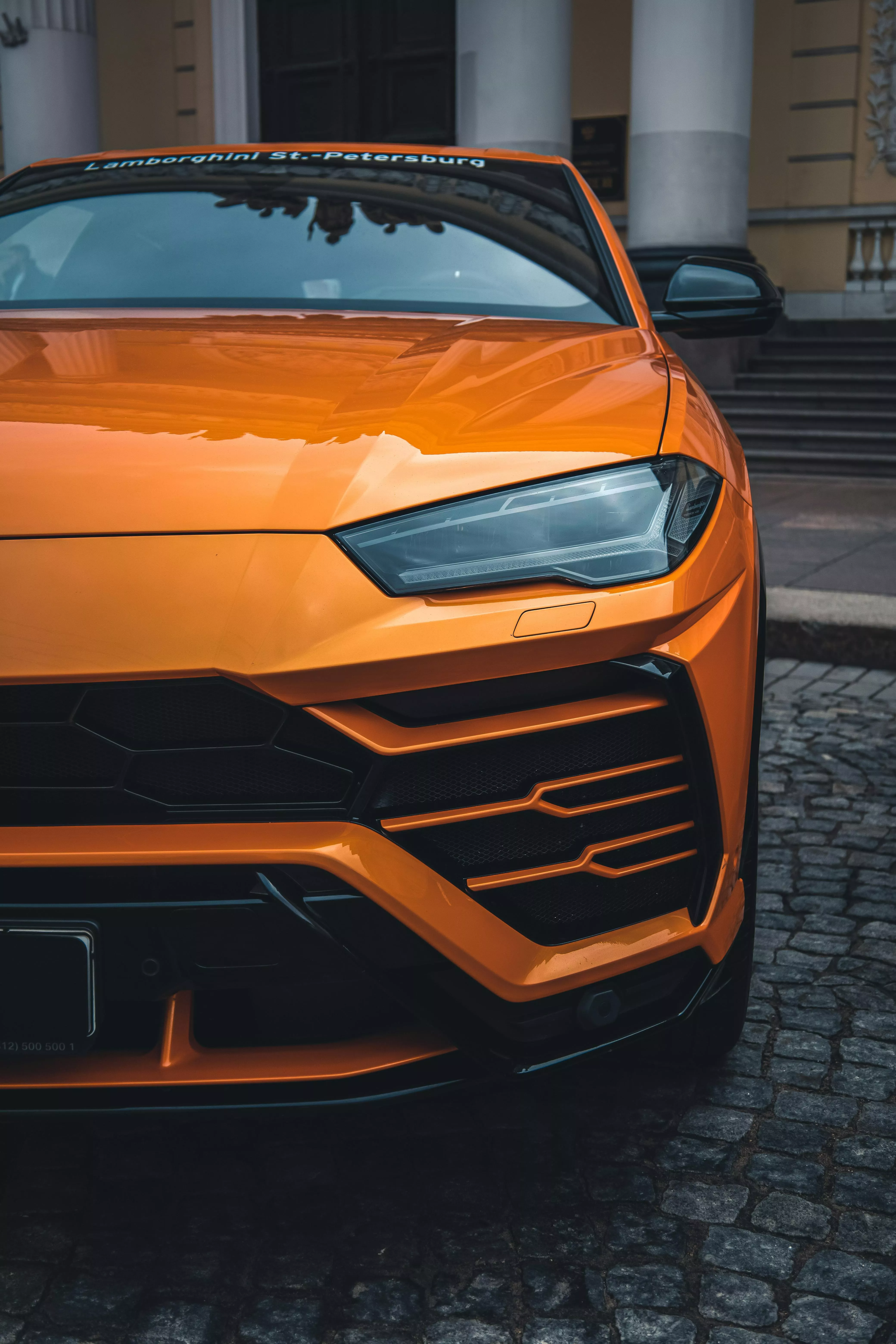 Orange Car on Stone Pavement · Free