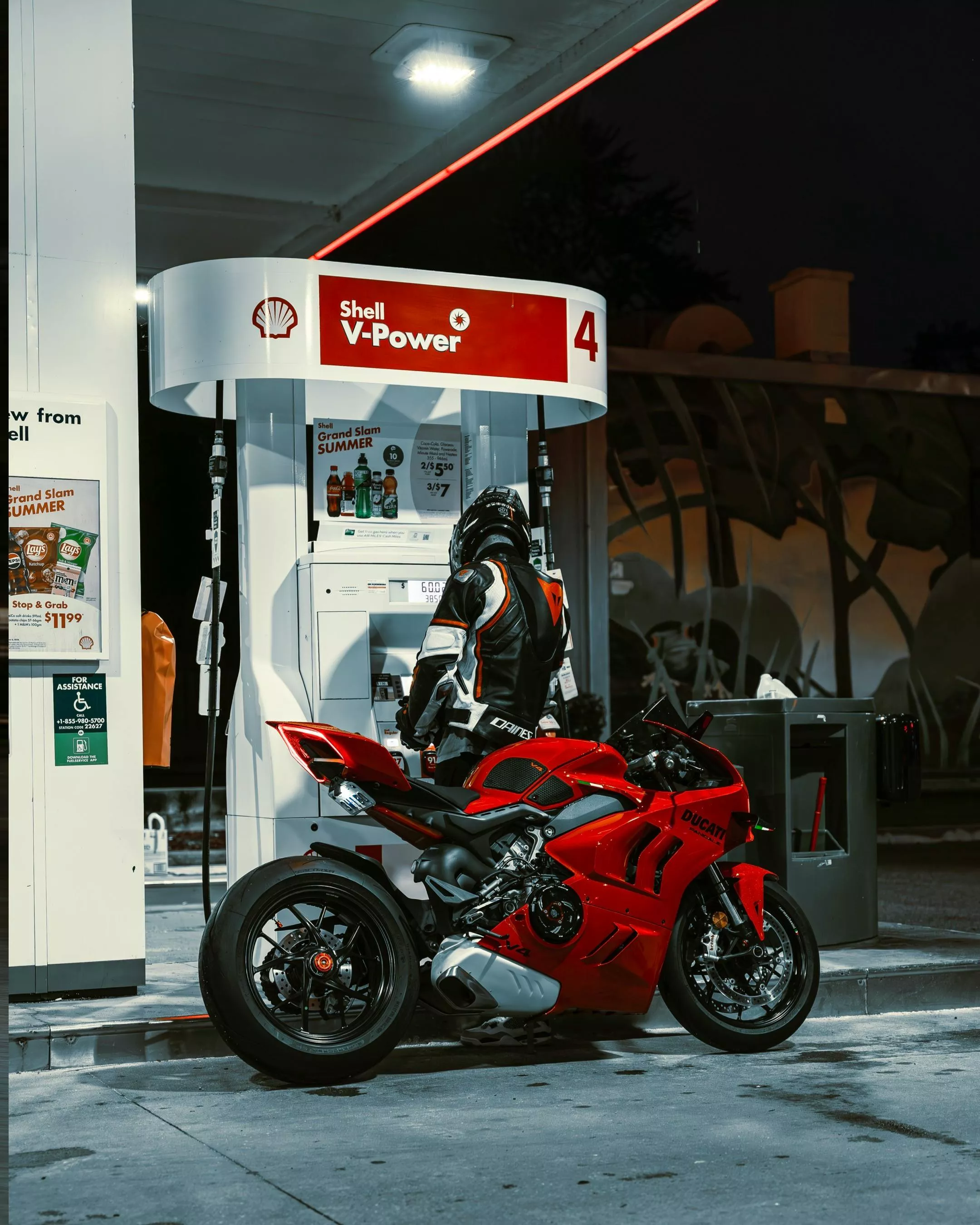 Biker with Motorcycle at Gas Station