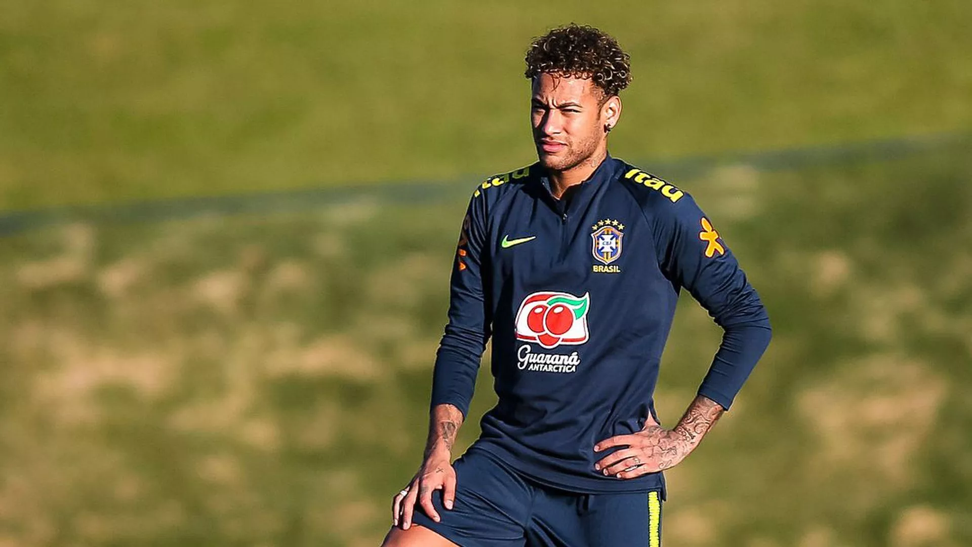 Neymar da Silva Santos Junior Is Standing In Blur Green Grass Background Wearing Blue Sports Dress HD Neymar Wallpaper
