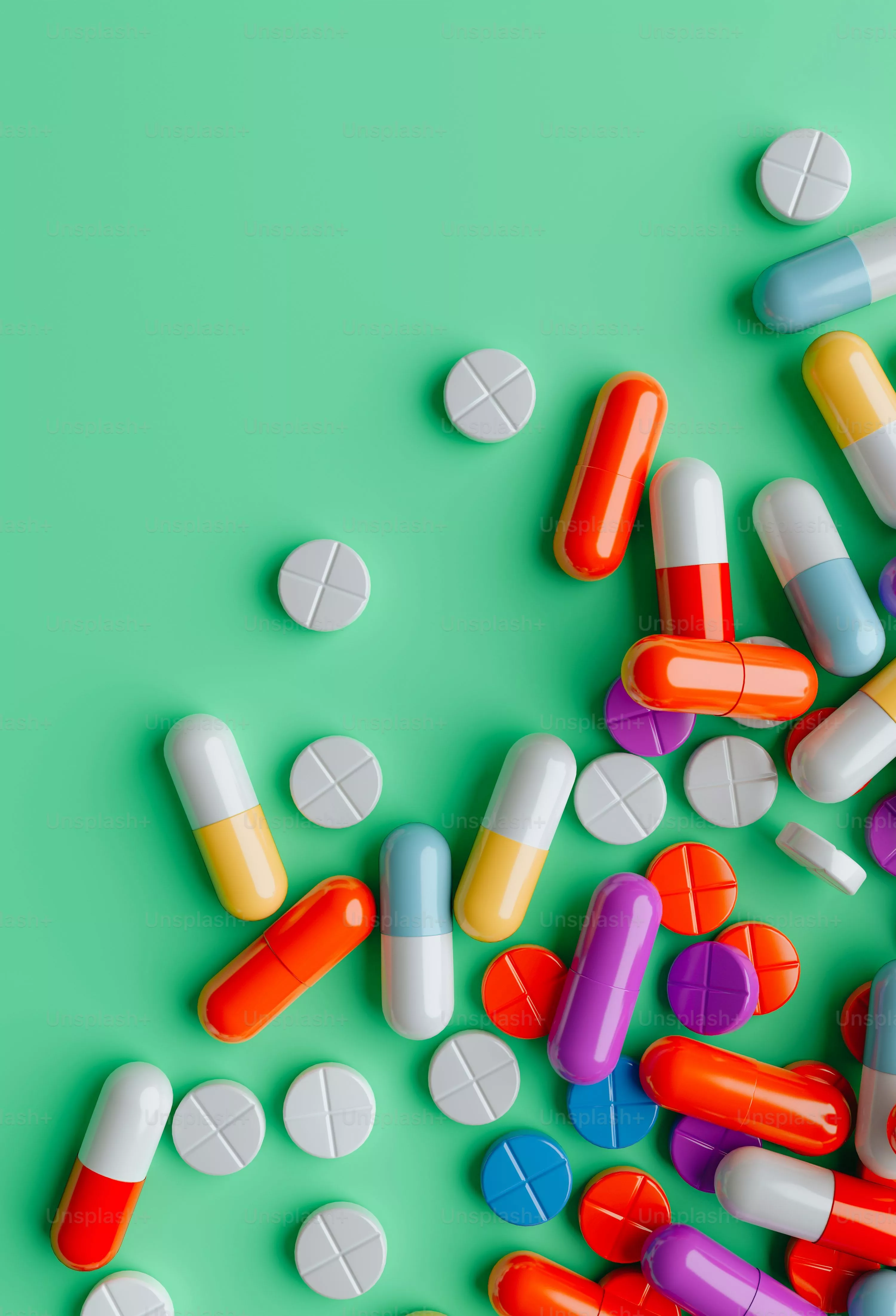 colorful pills on a green background