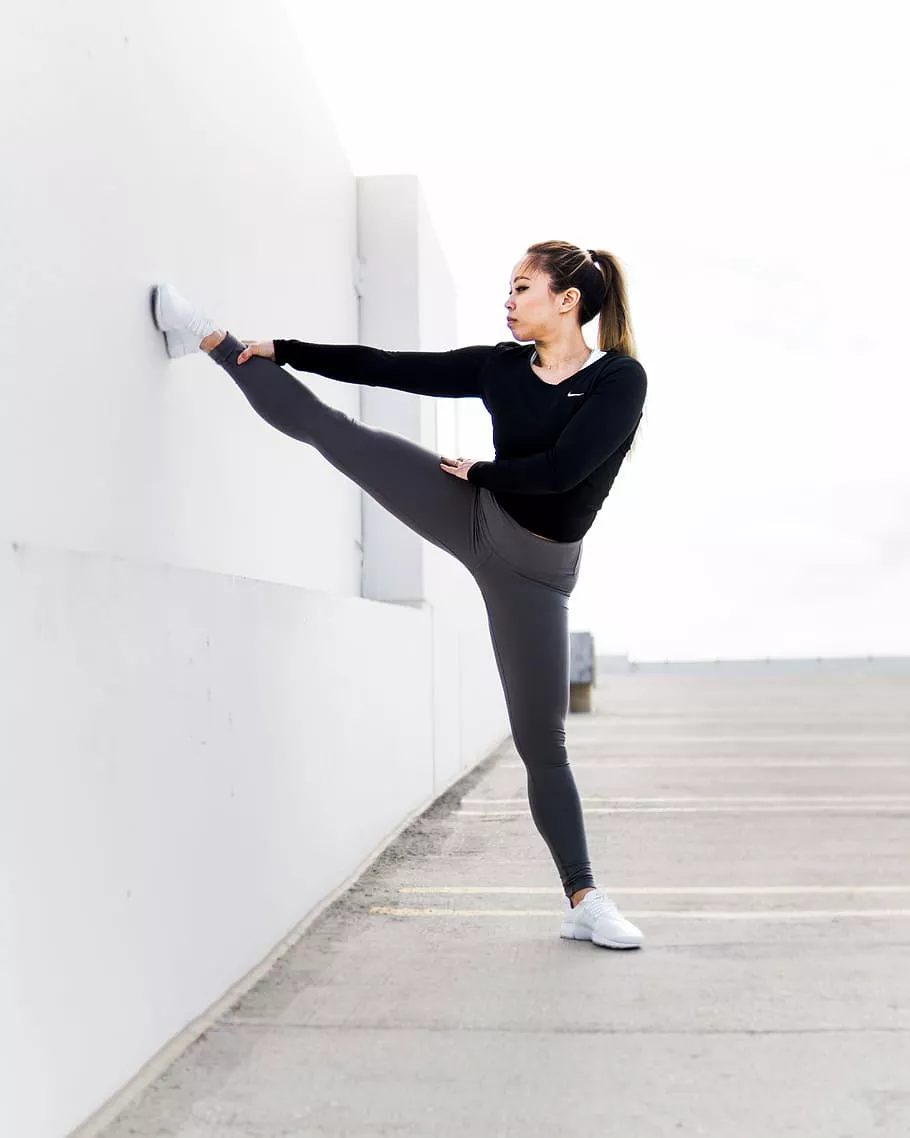 HD wallpaper: woman stretching on white