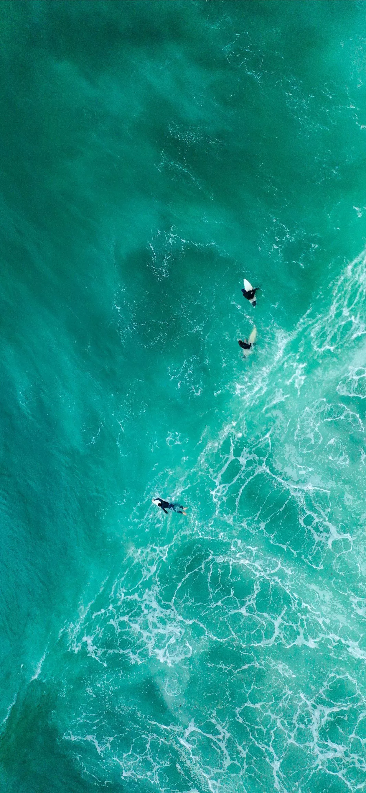 surfers on sea iPhone SE Wallpaper