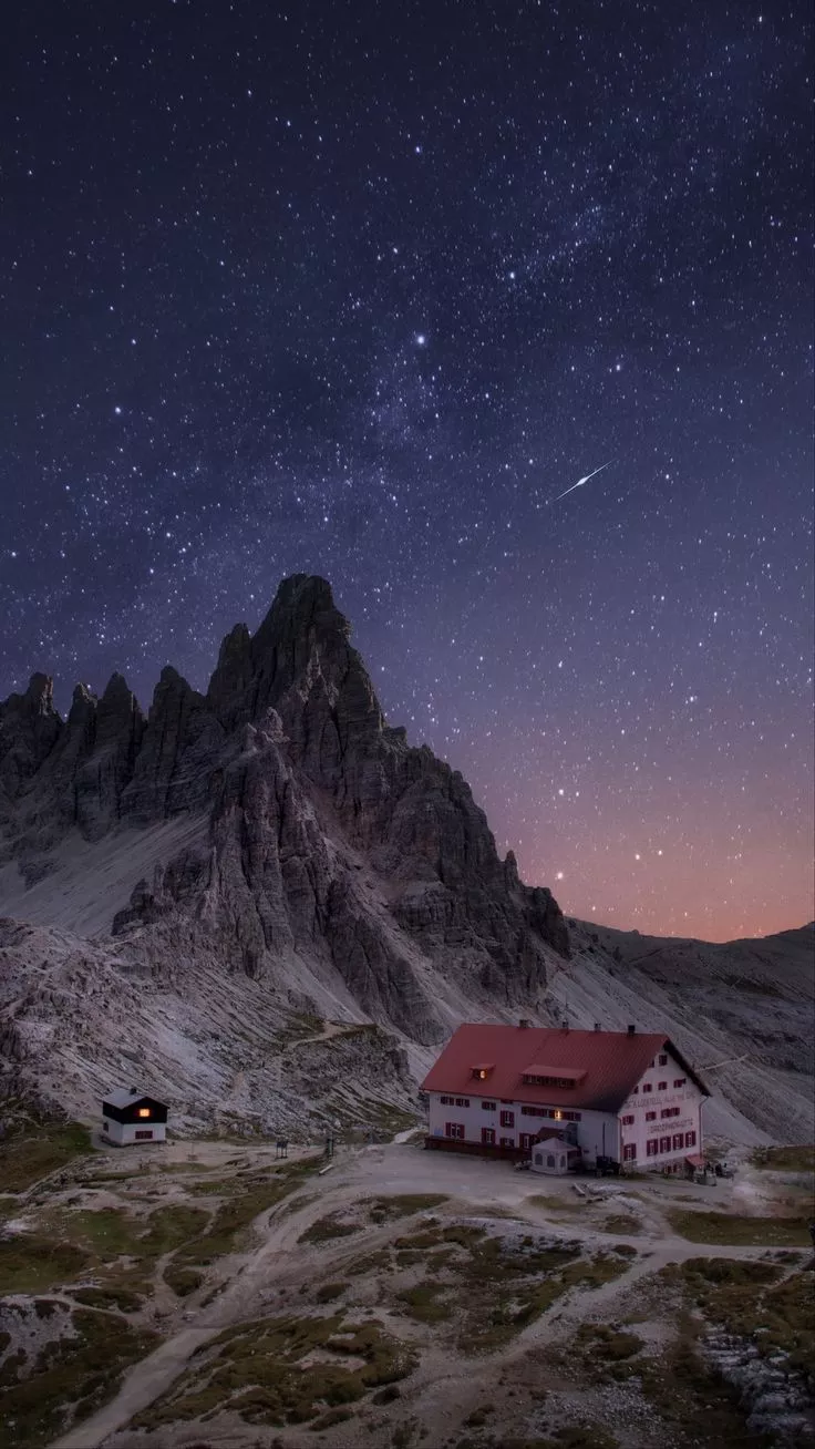 Rocks, mountains, starry sky, house
