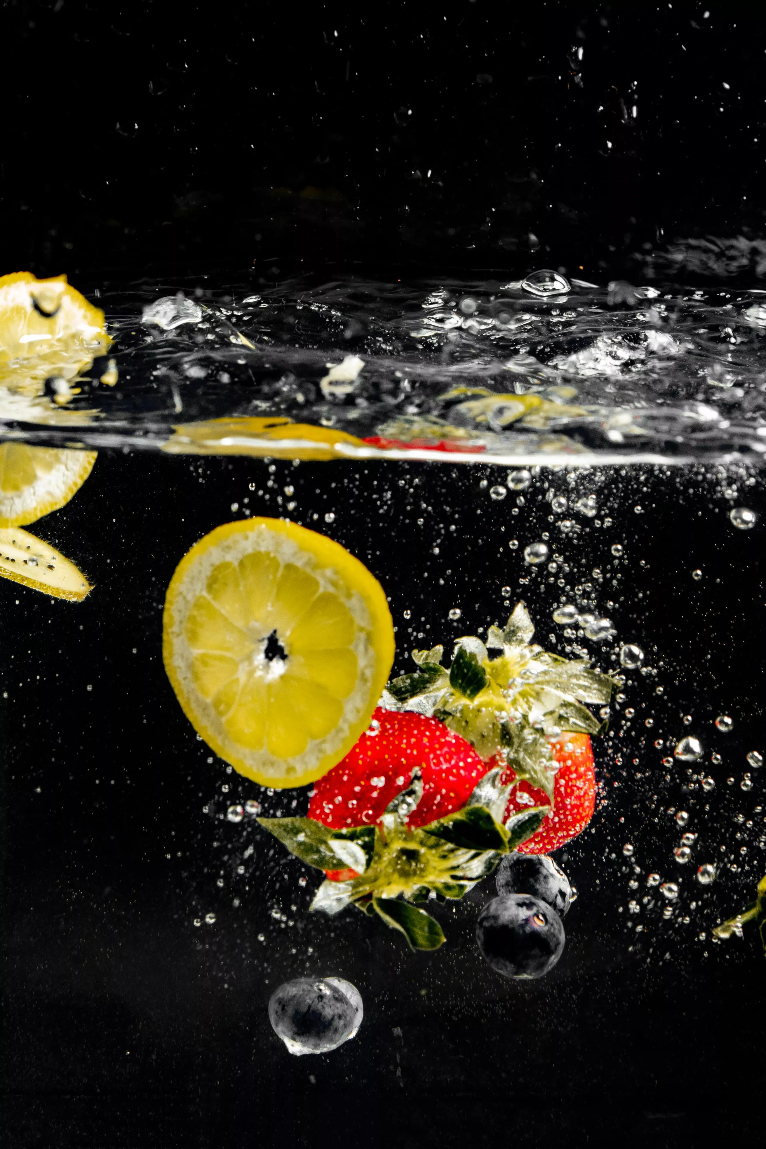 Sliced Lemon and Strawberries in Water