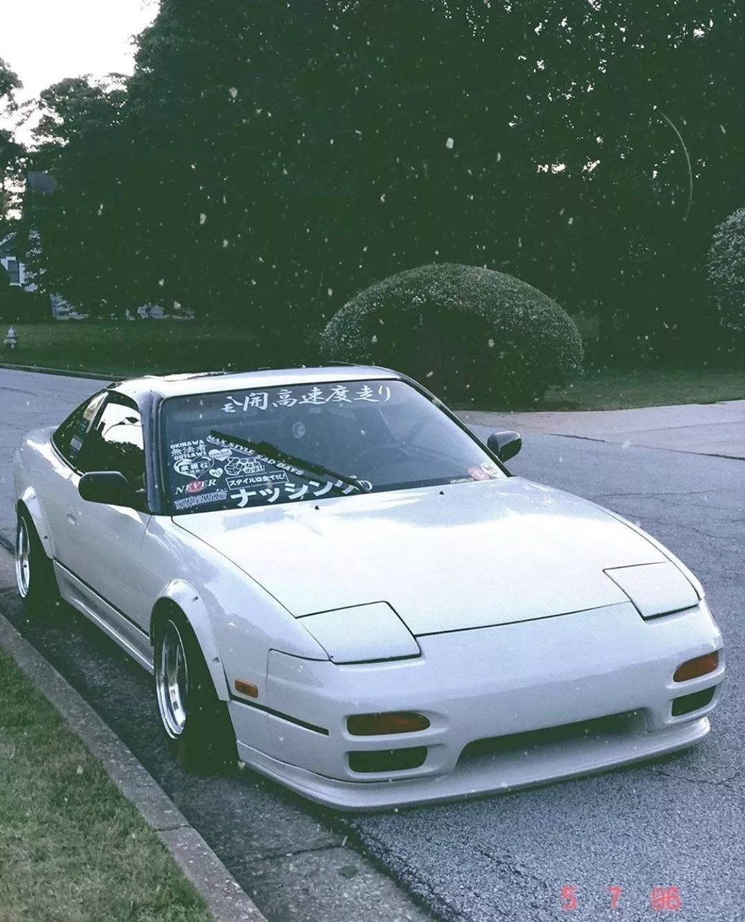 Download White JDM Car Parked On Street