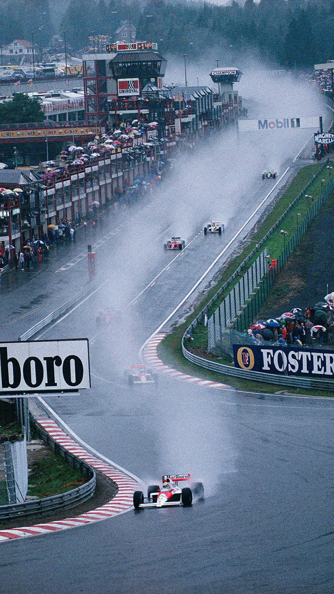 Download Celebrating the Thrill of the Race with the Formula 1 iPhone Wallpaper