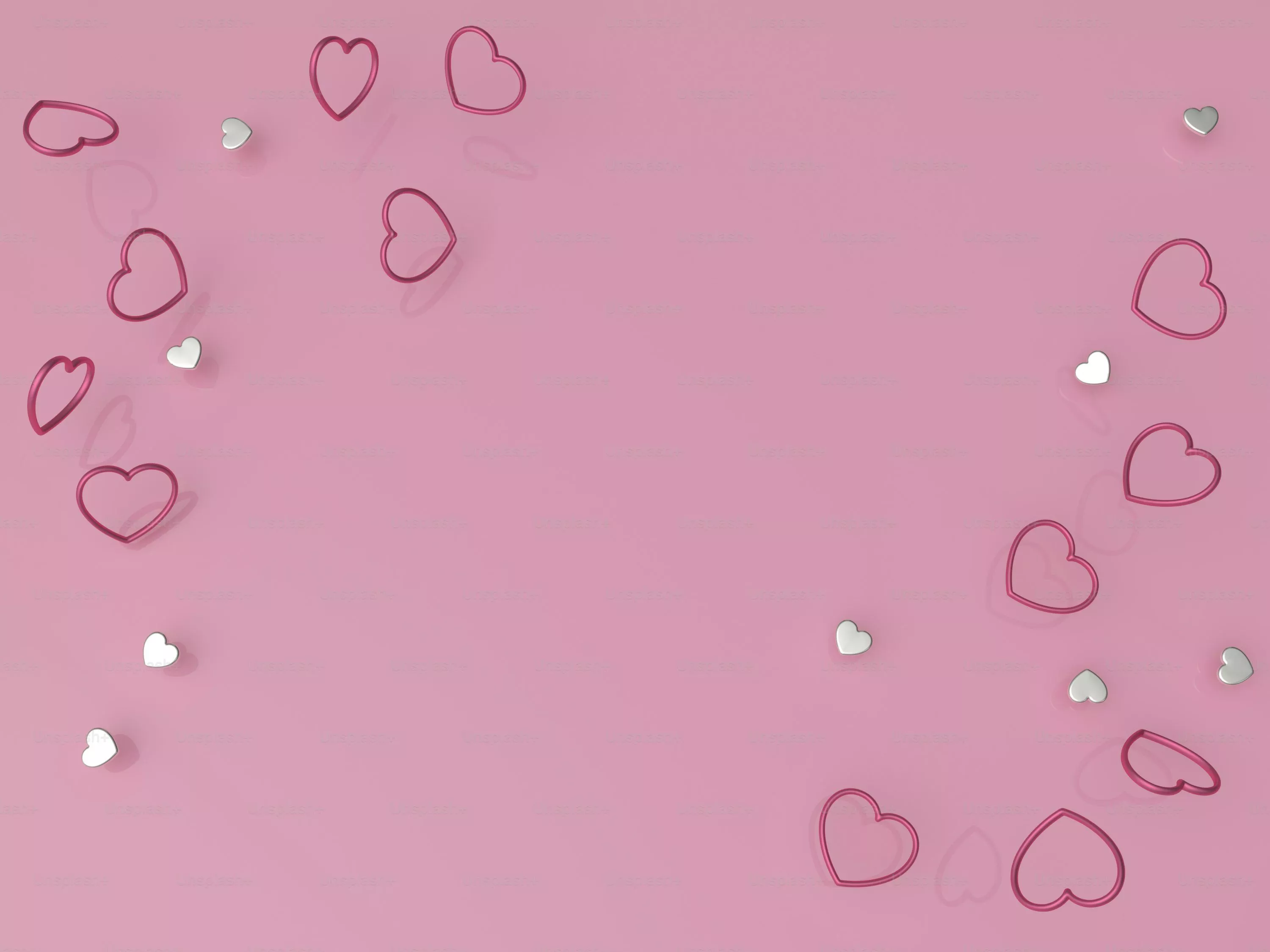 A pink background with lots of hearts